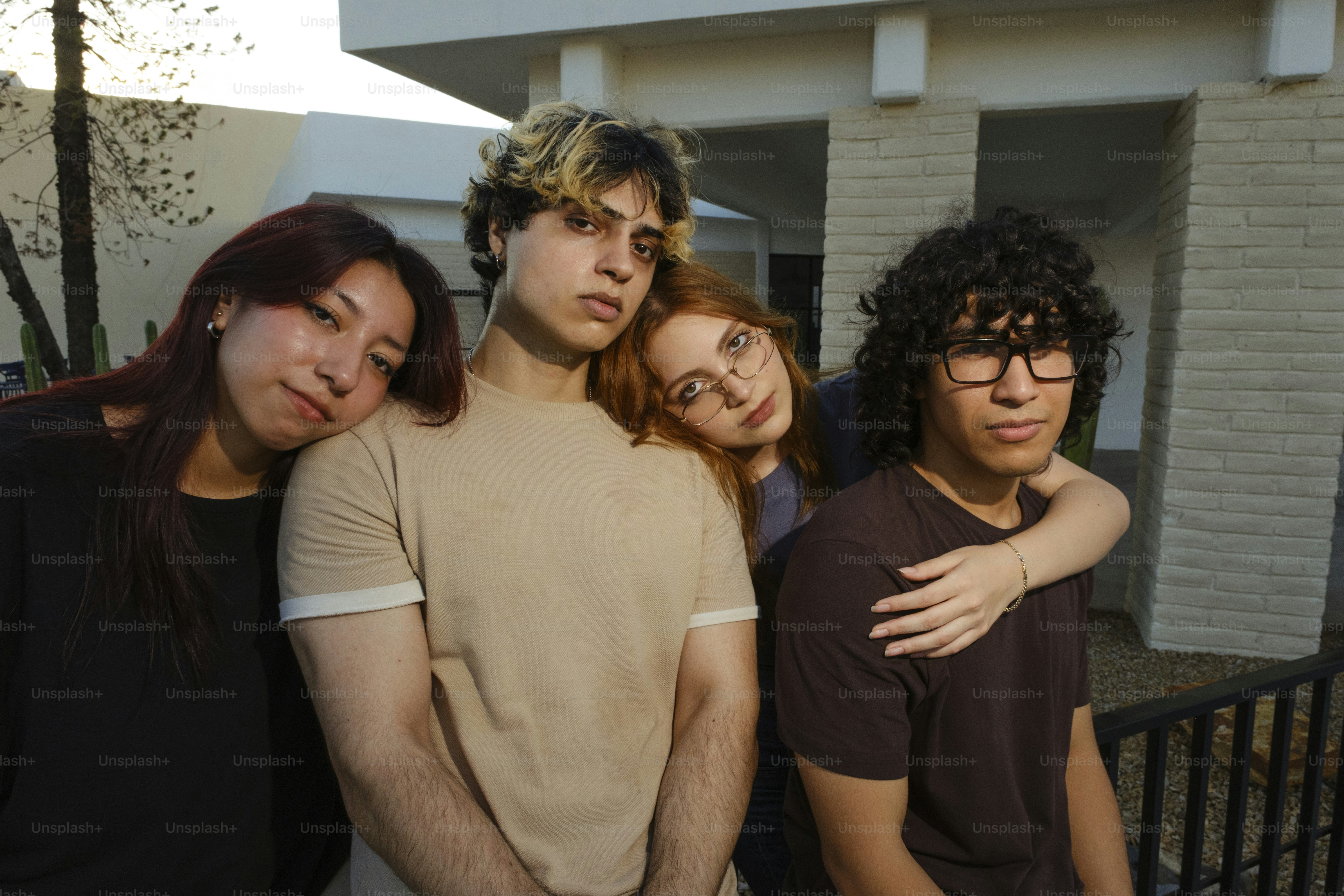 Four young people posing for a group portrait