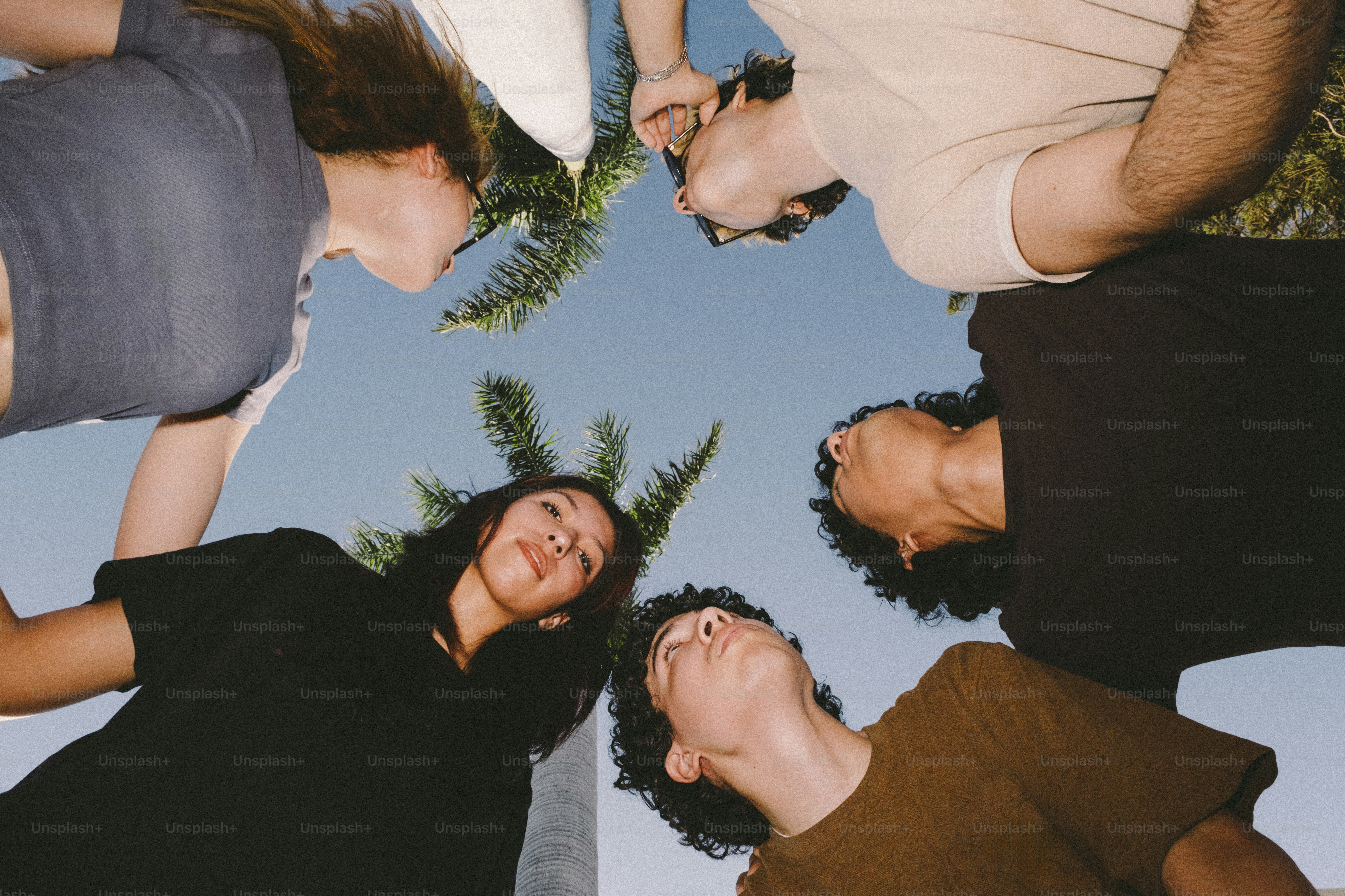 Four friends looking up at the sky