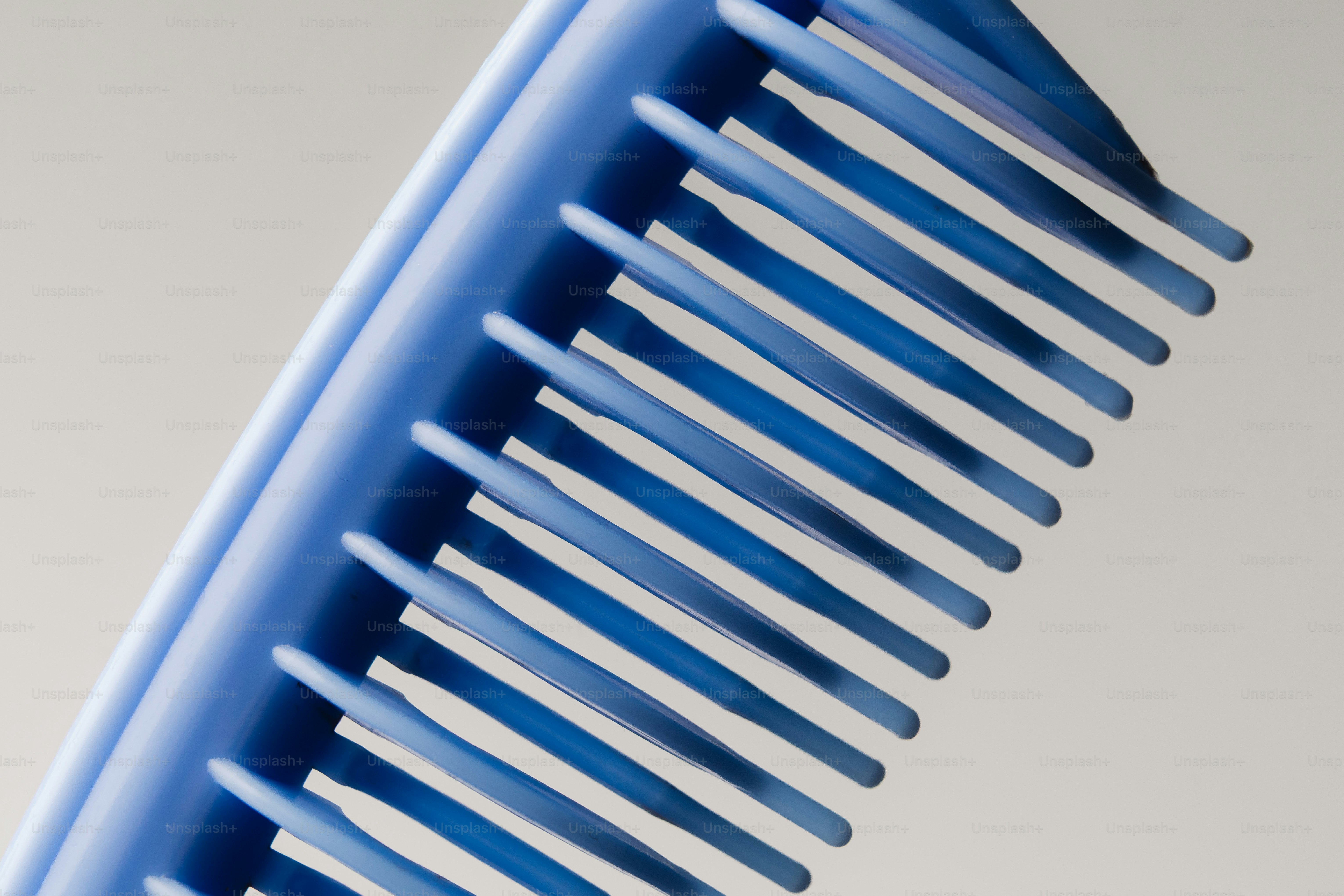 A close-up of a blue plastic comb photo – Fashion Image on Unsplash