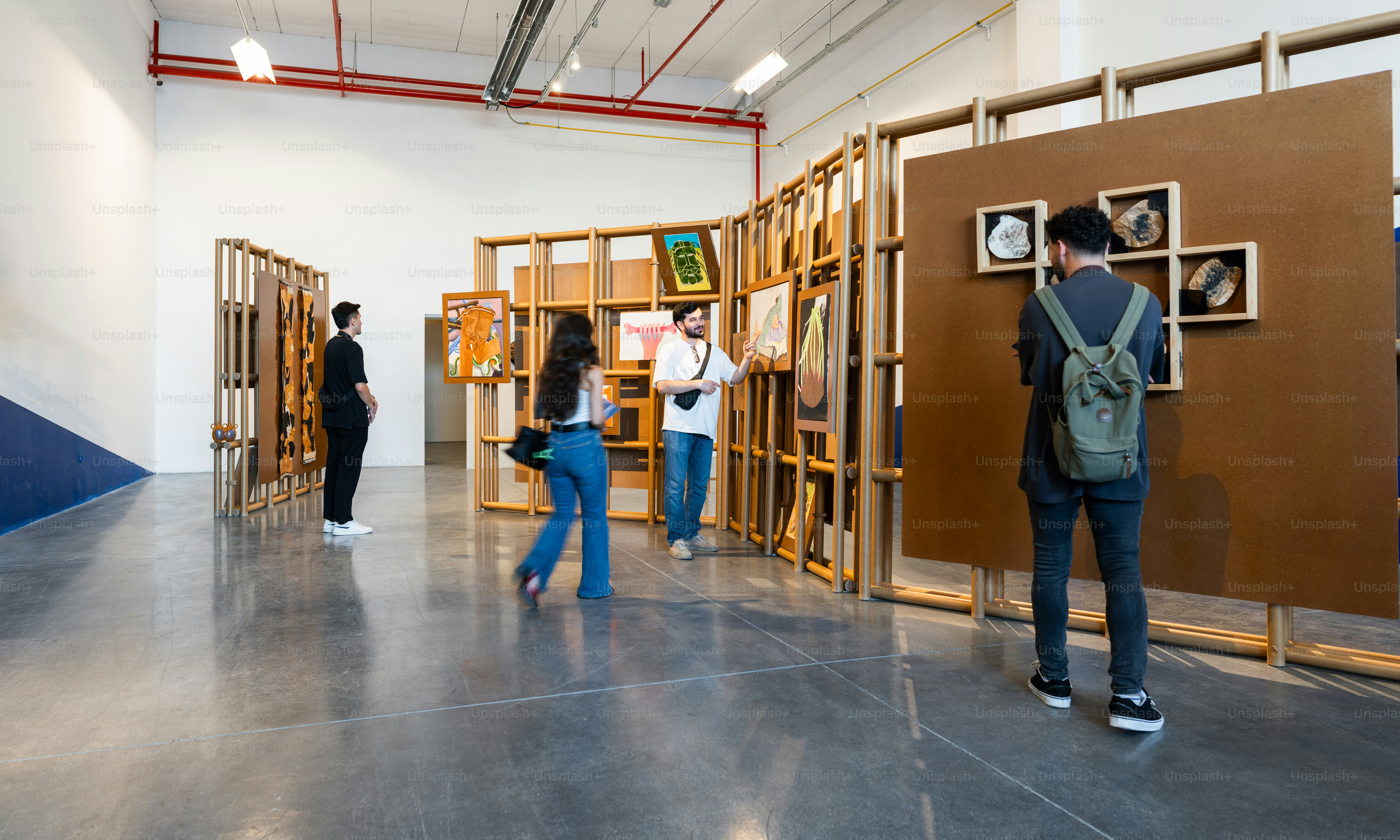 People observing art at an exhibition