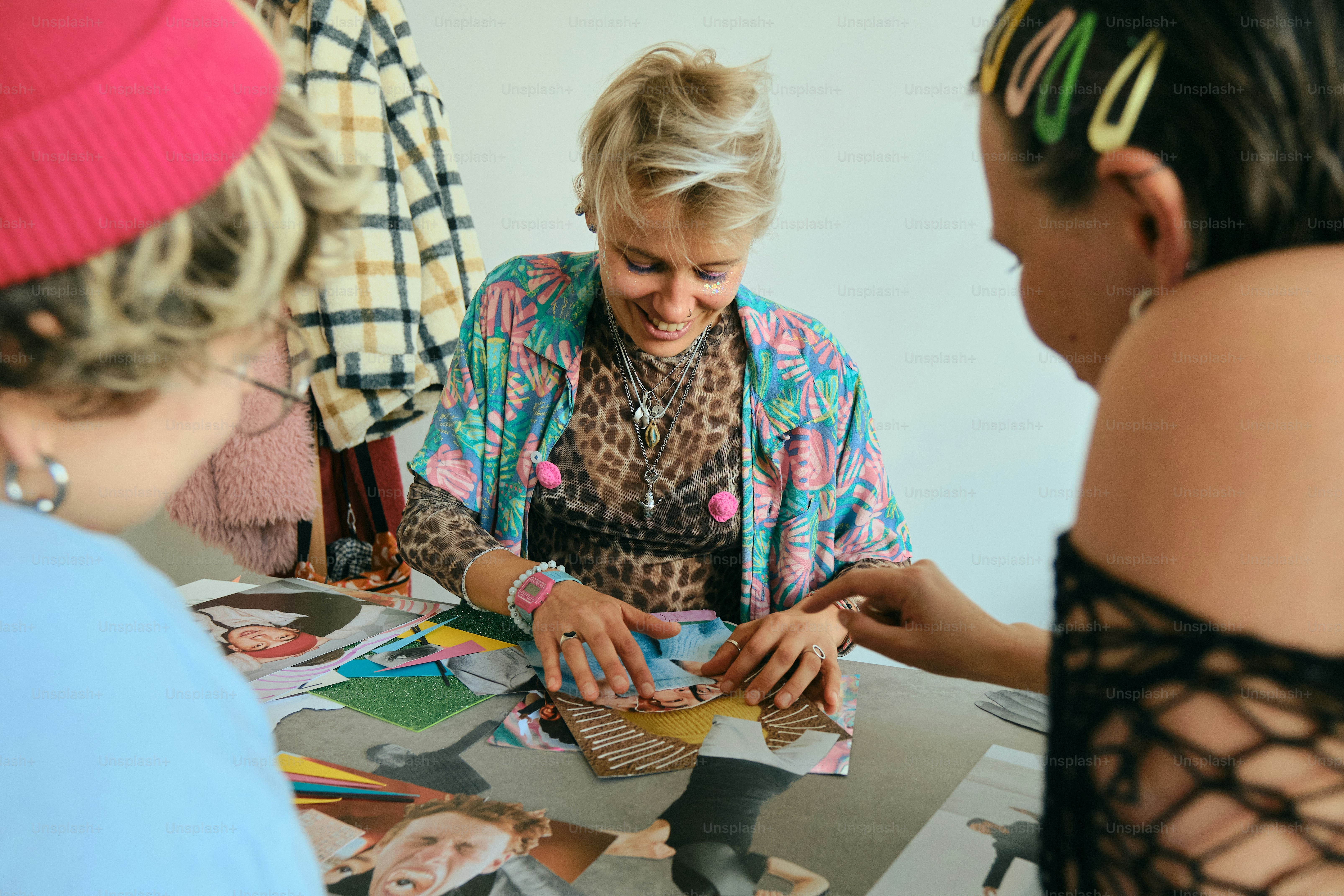 Three people gathered around a table with papers.