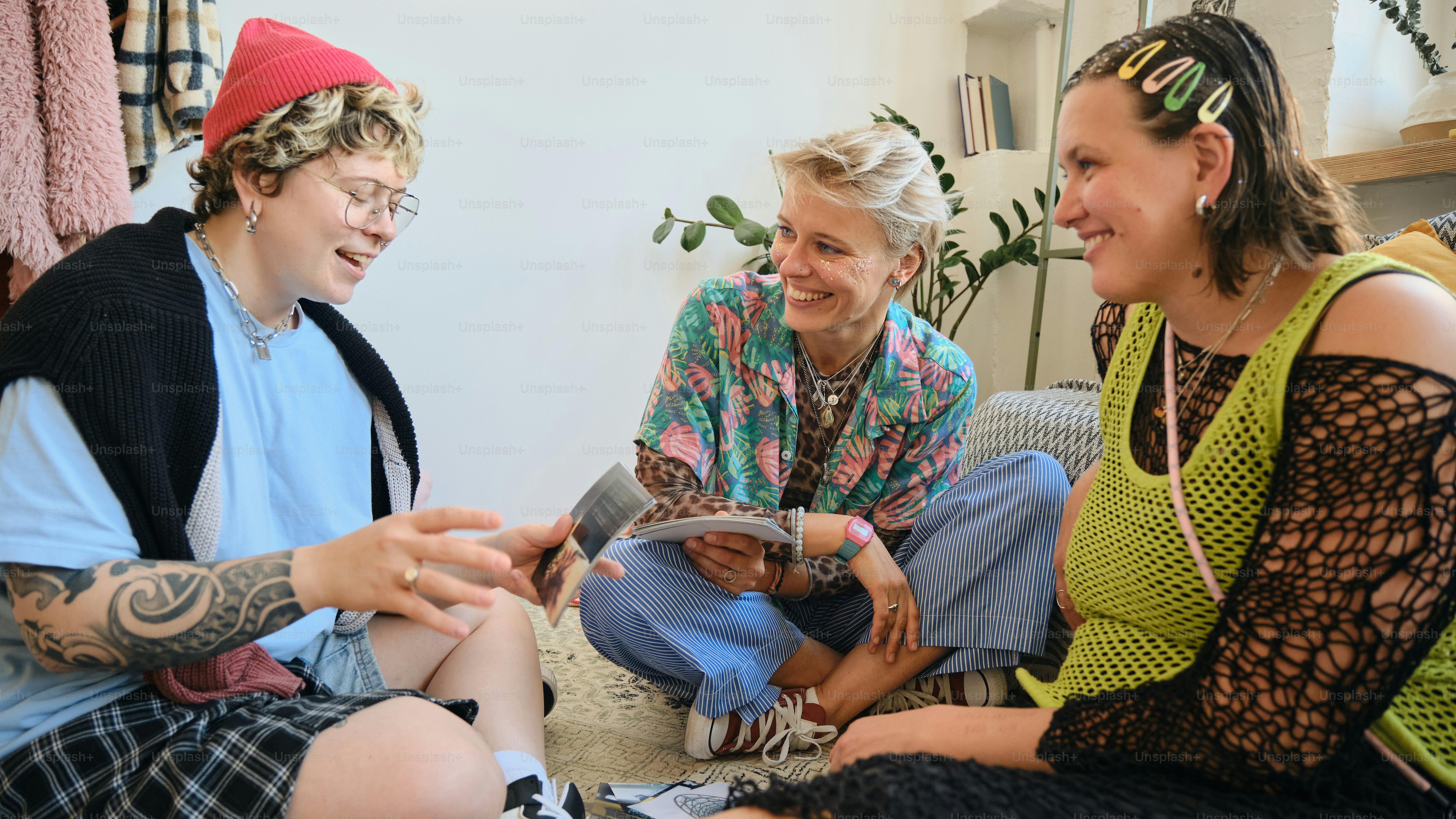 Three people talking and laughing together indoors. photo – Diversity ...
