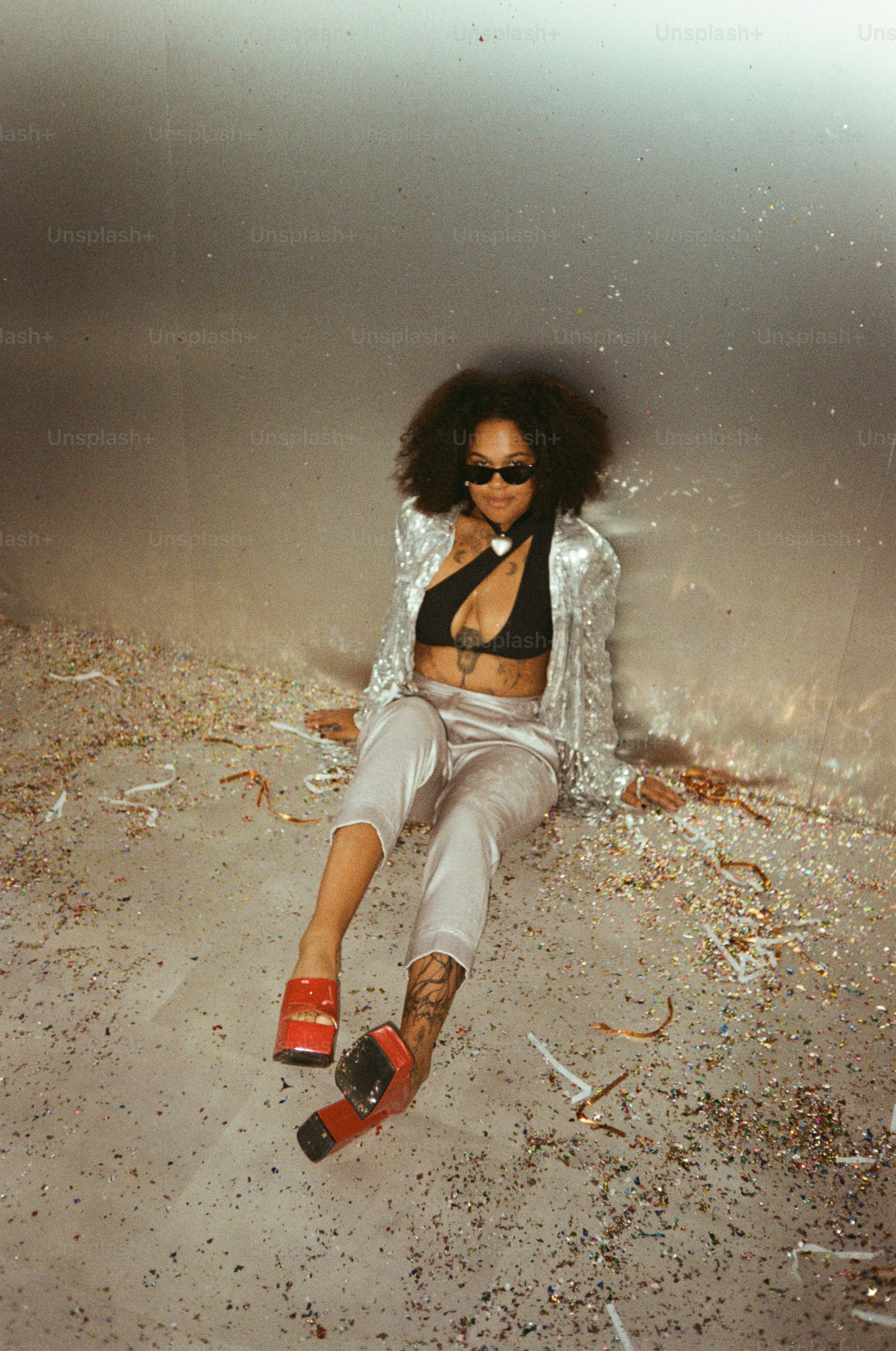 Woman in sparkly jacket with confetti