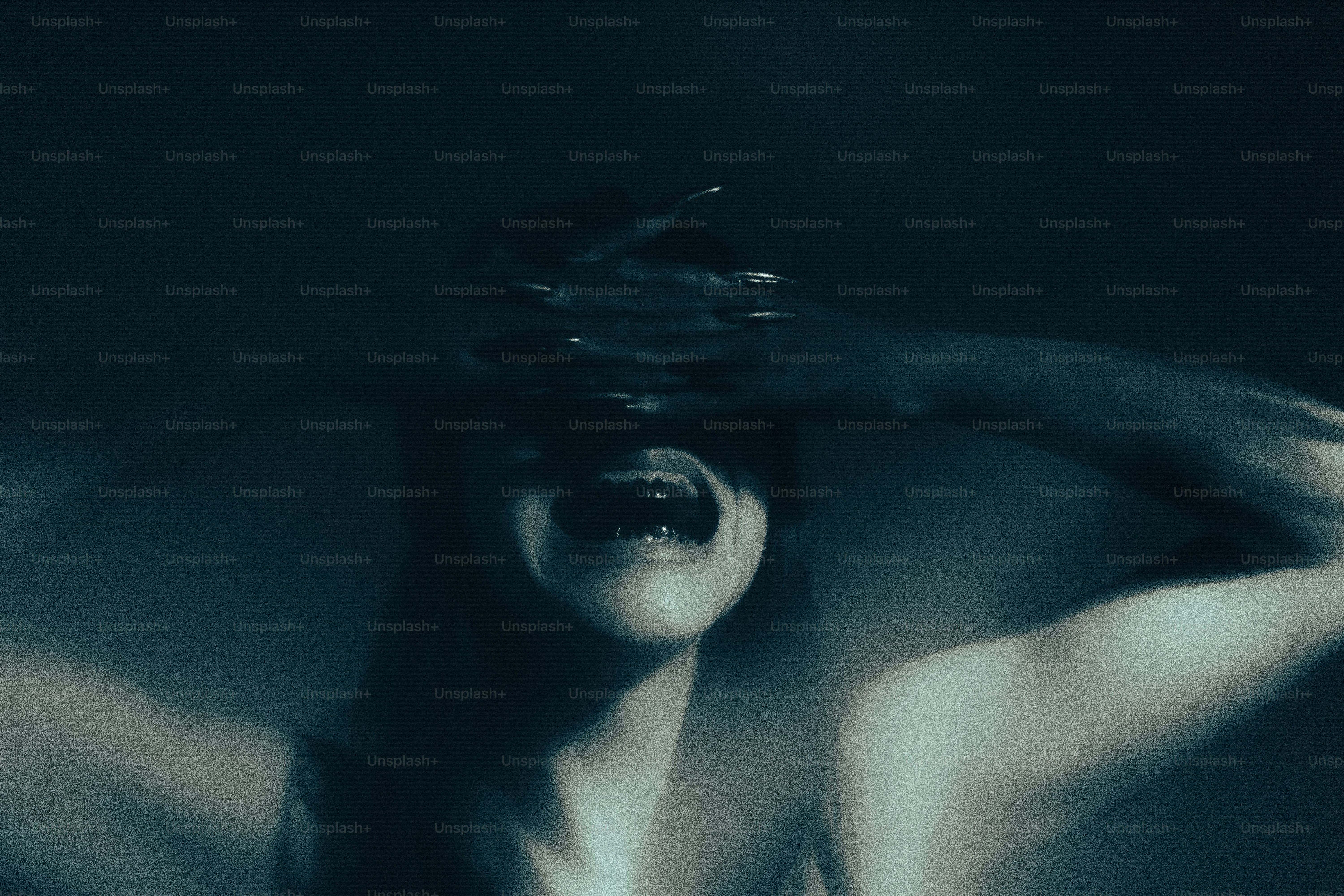 A distressed person covering their eyes and screaming.