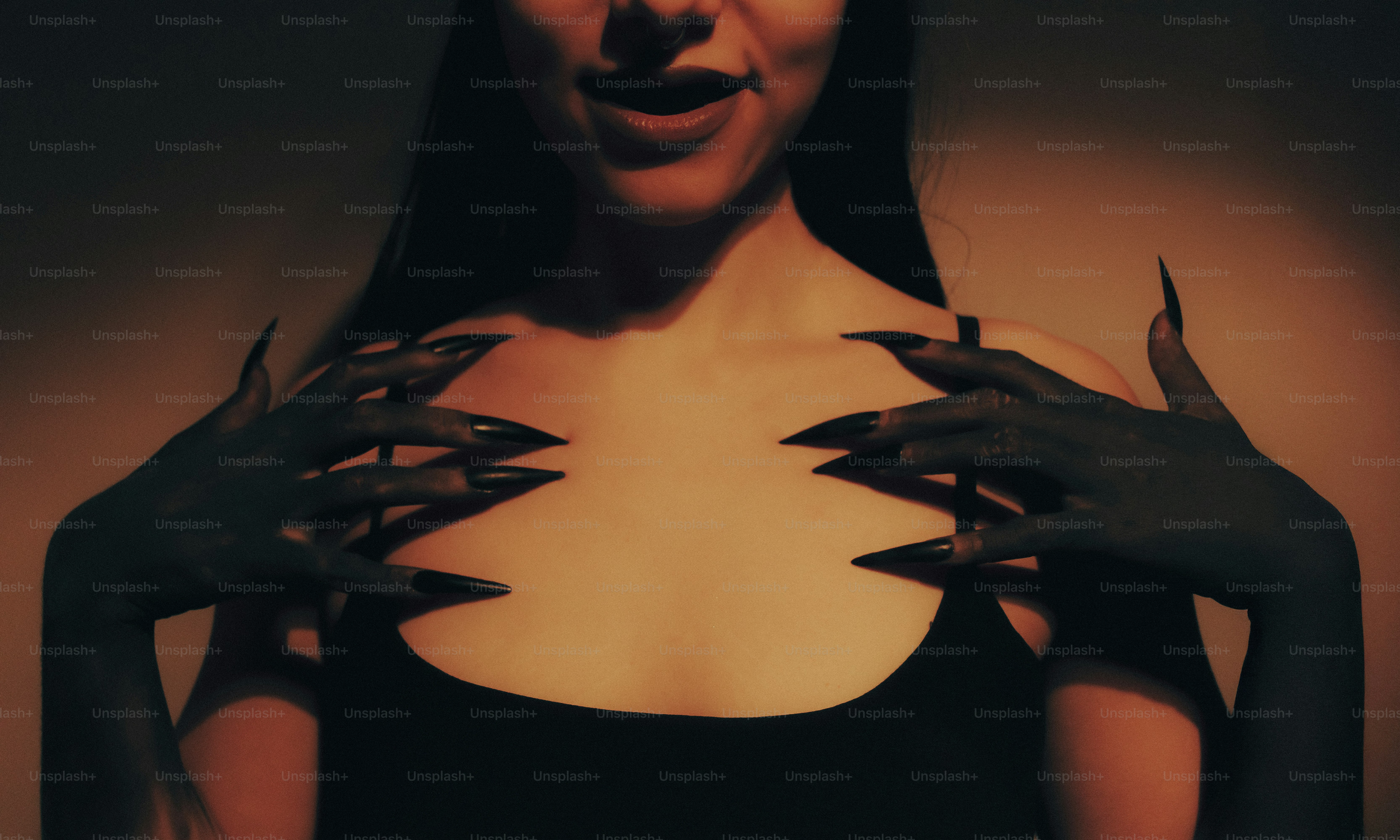 Woman with long sharp nails and dark skin