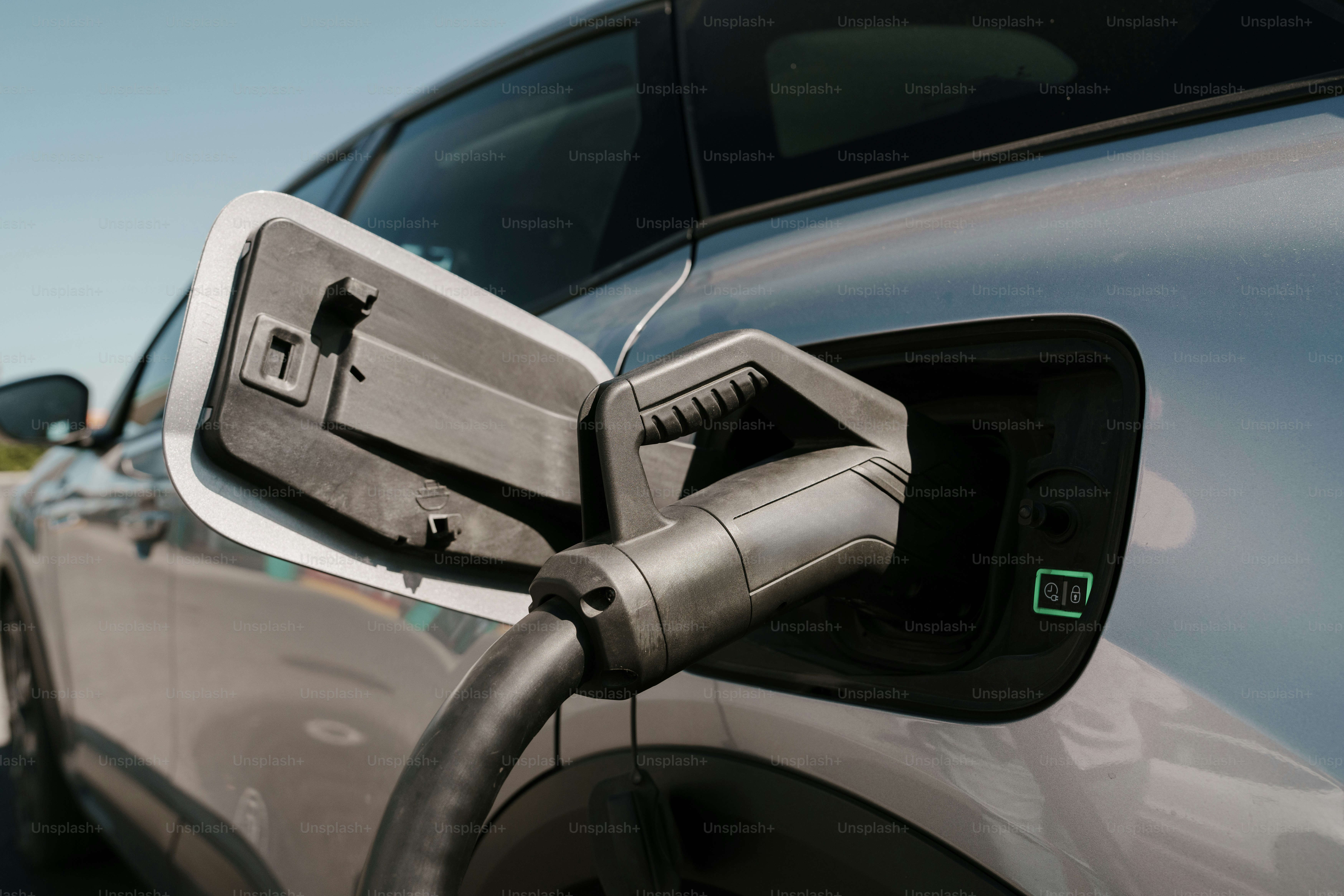 Electric car charging port with plug inserted