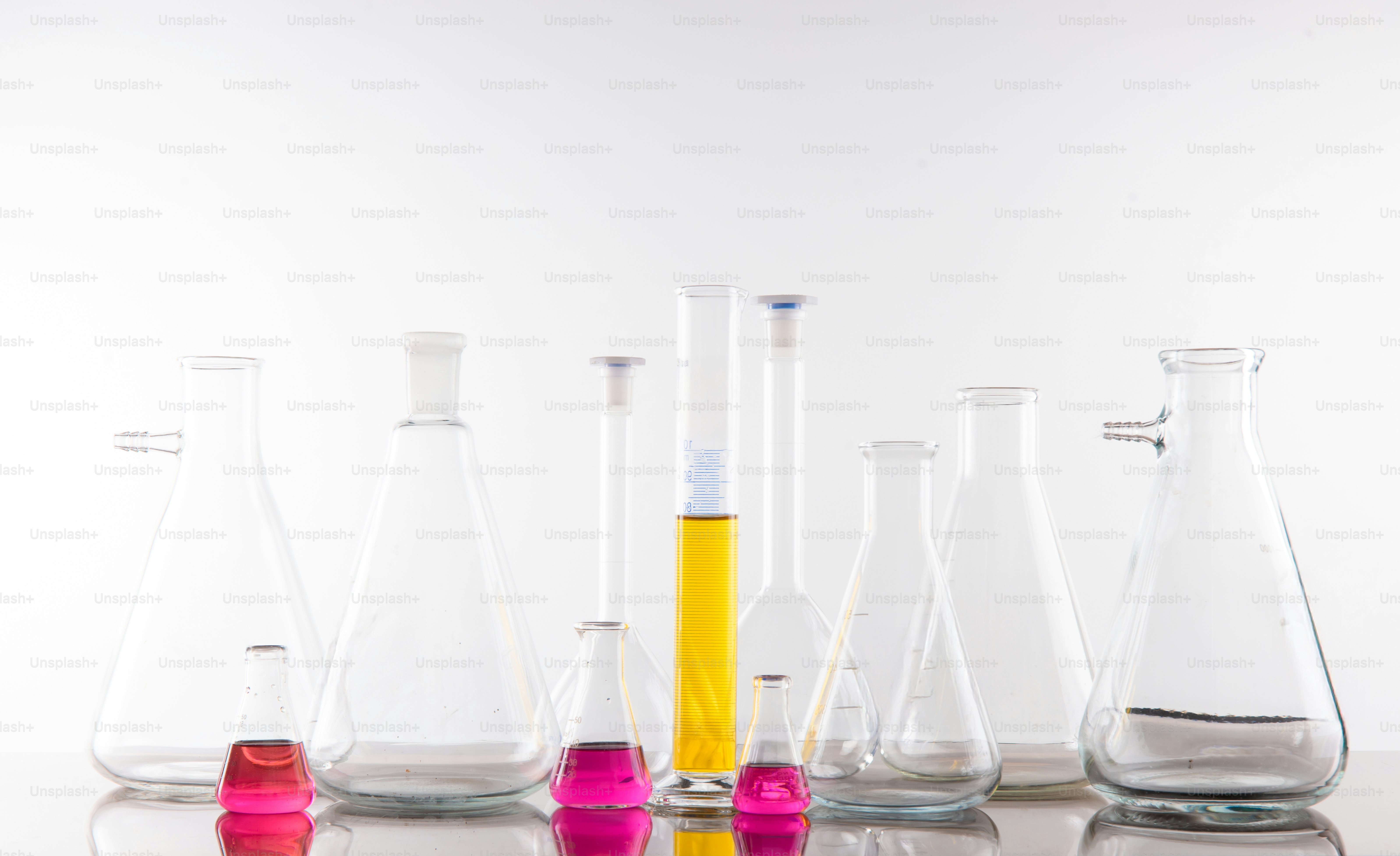 Various laboratory glassware with colorful liquids