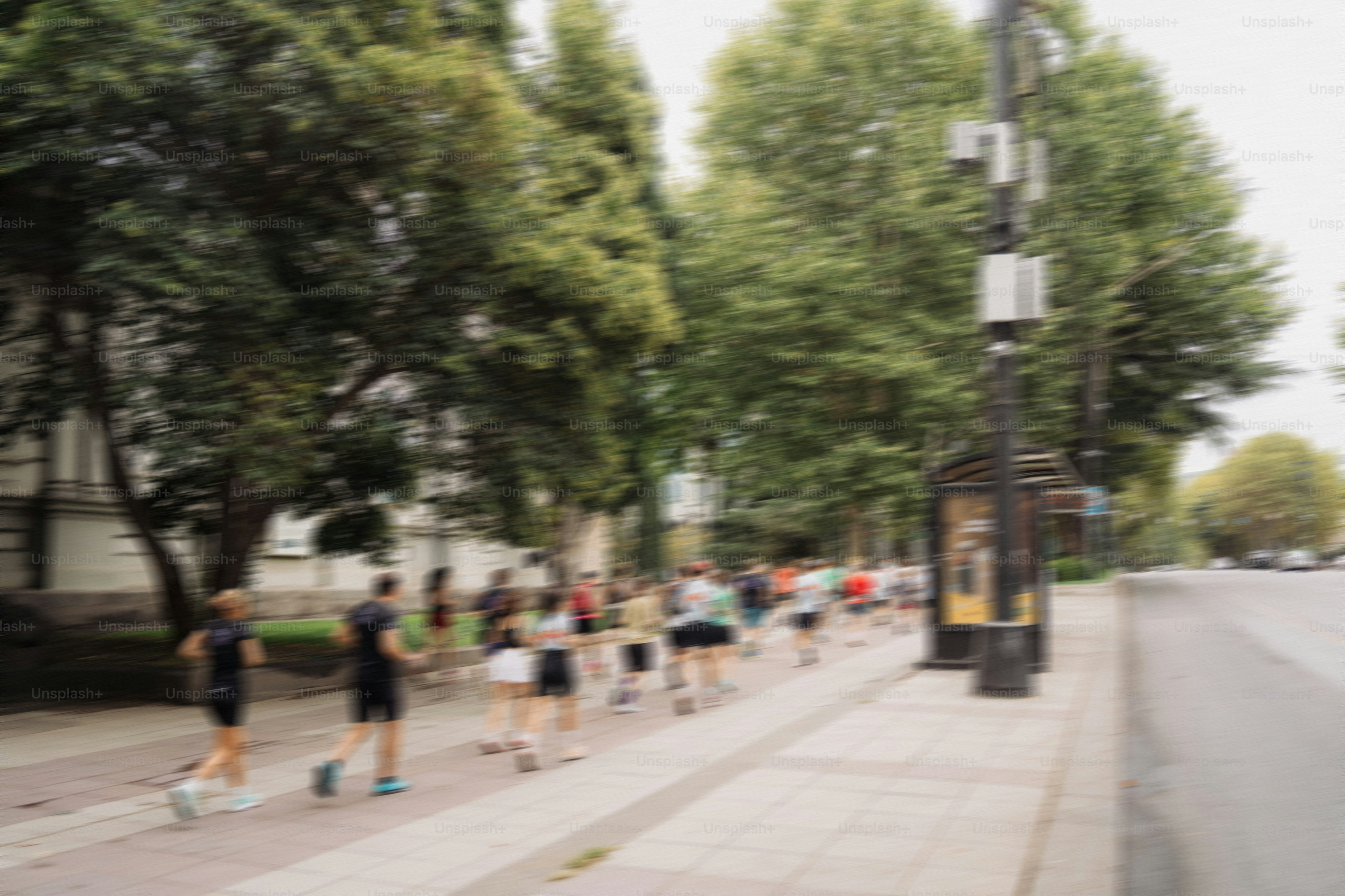 Group of runners on a city sidewalk