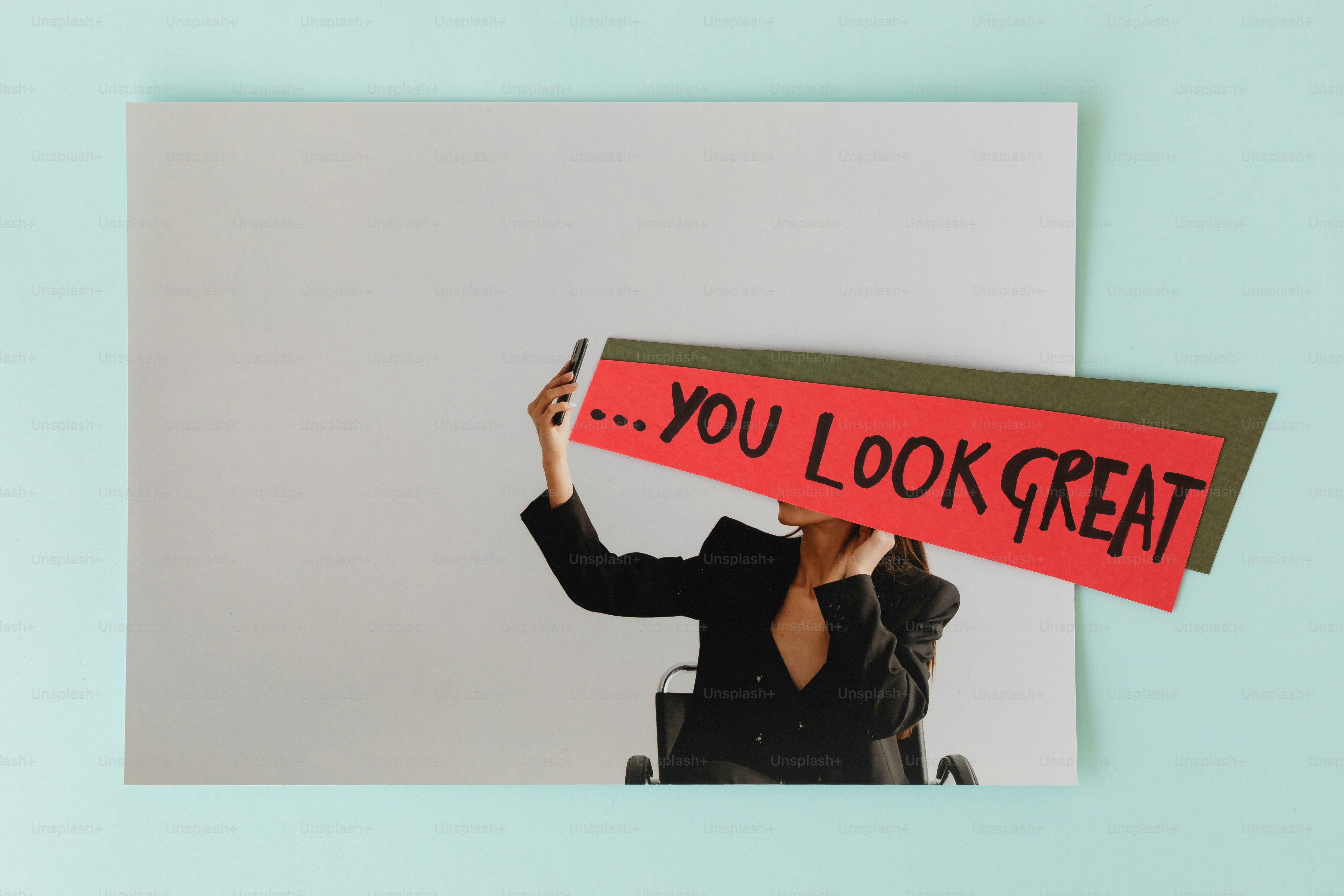 Person holding sign that says "you look great"