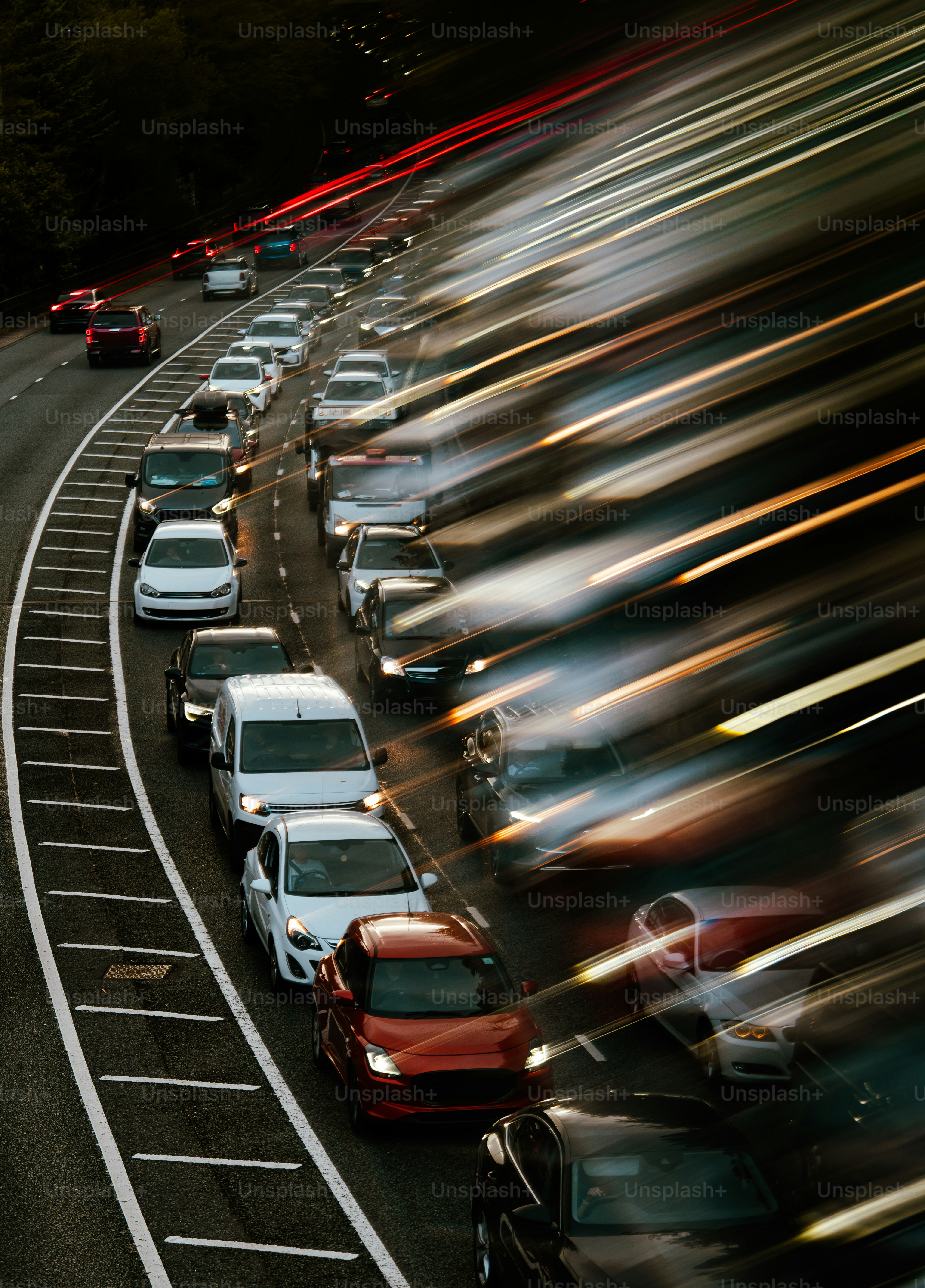 Cars in traffic with light trails at night