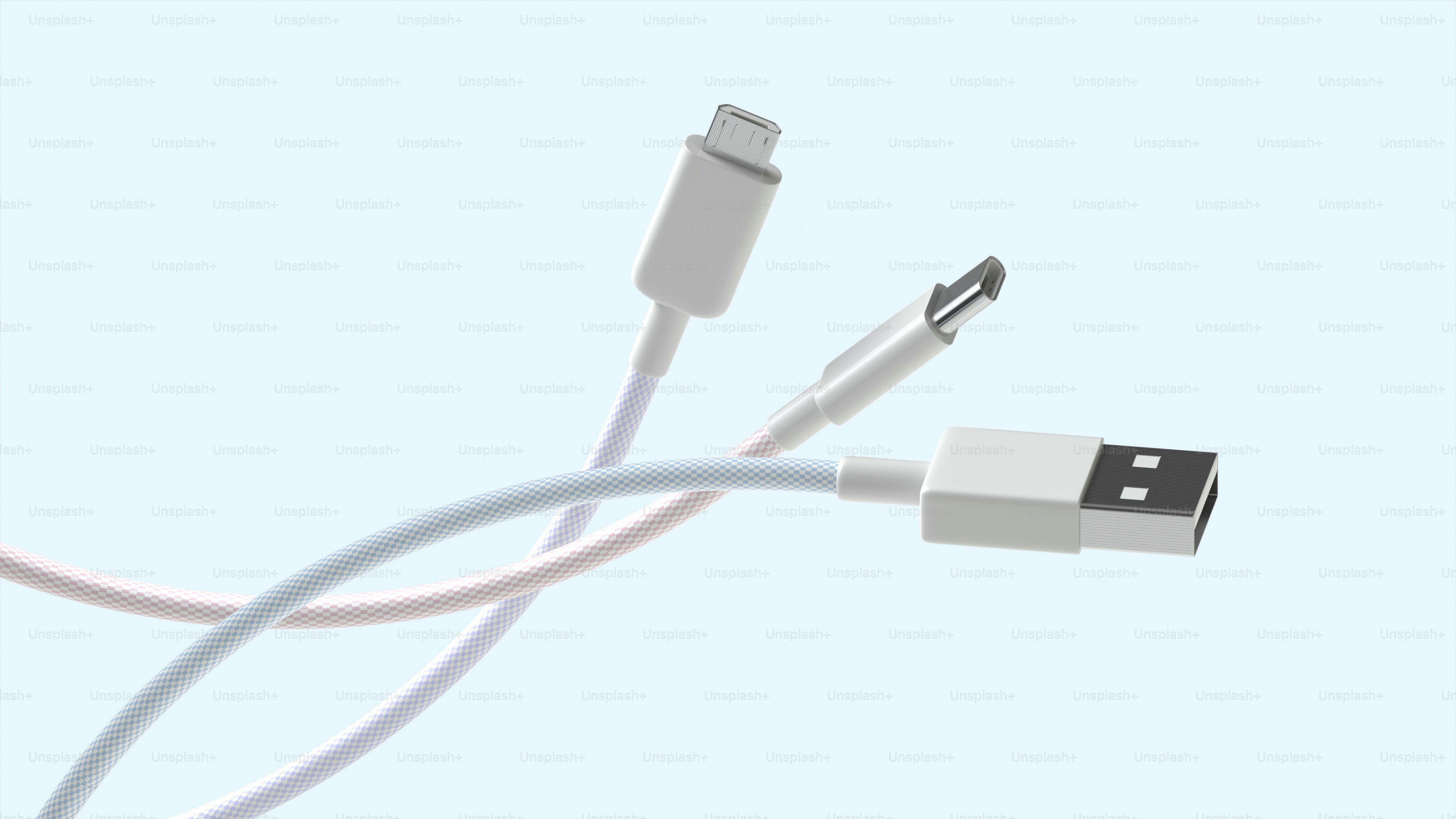 Three white charging cables on a light blue background