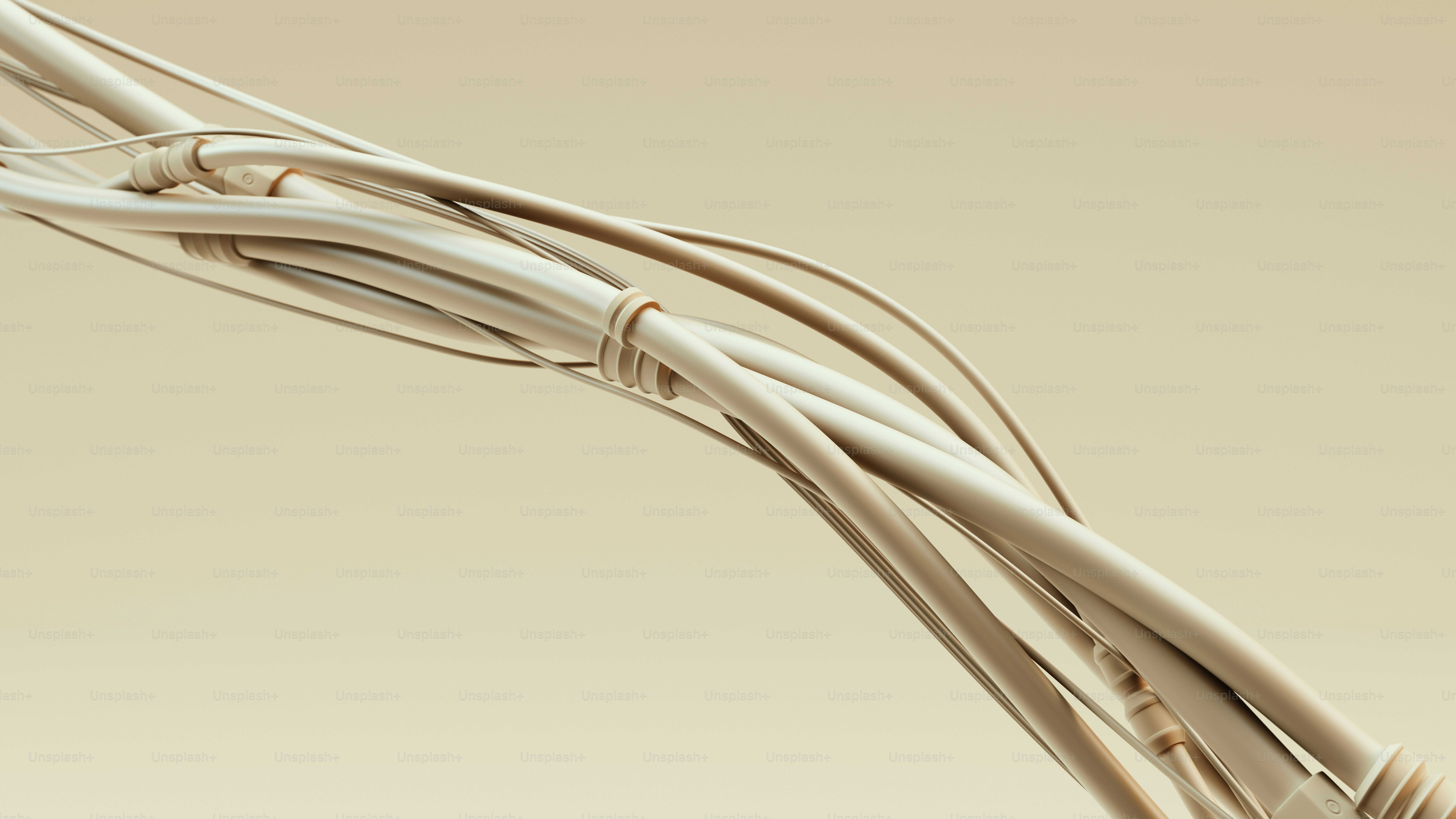 Câbles beiges groupés sur un fond neutre