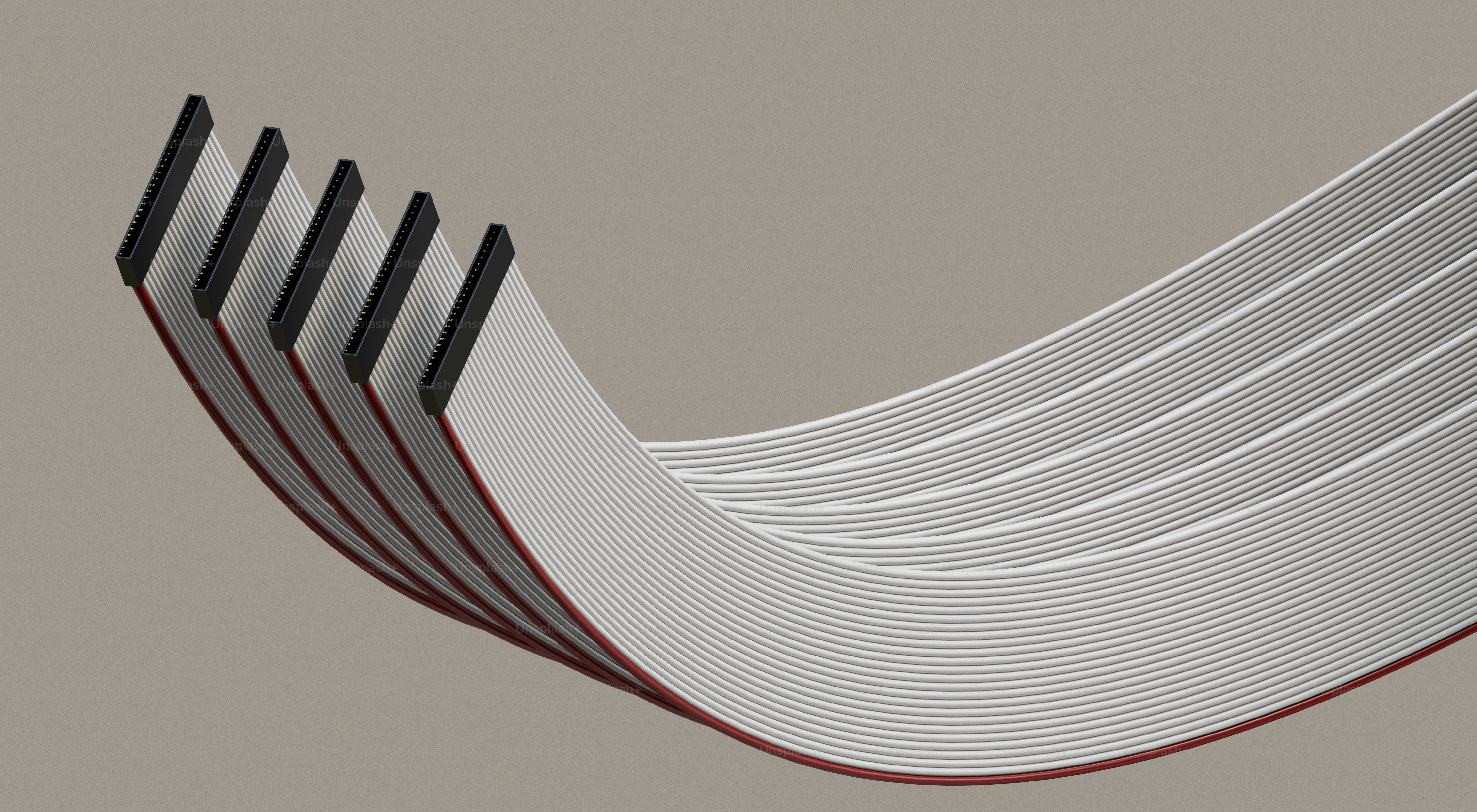 Cabos de fita planos espalhando-se sobre um fundo neutro
