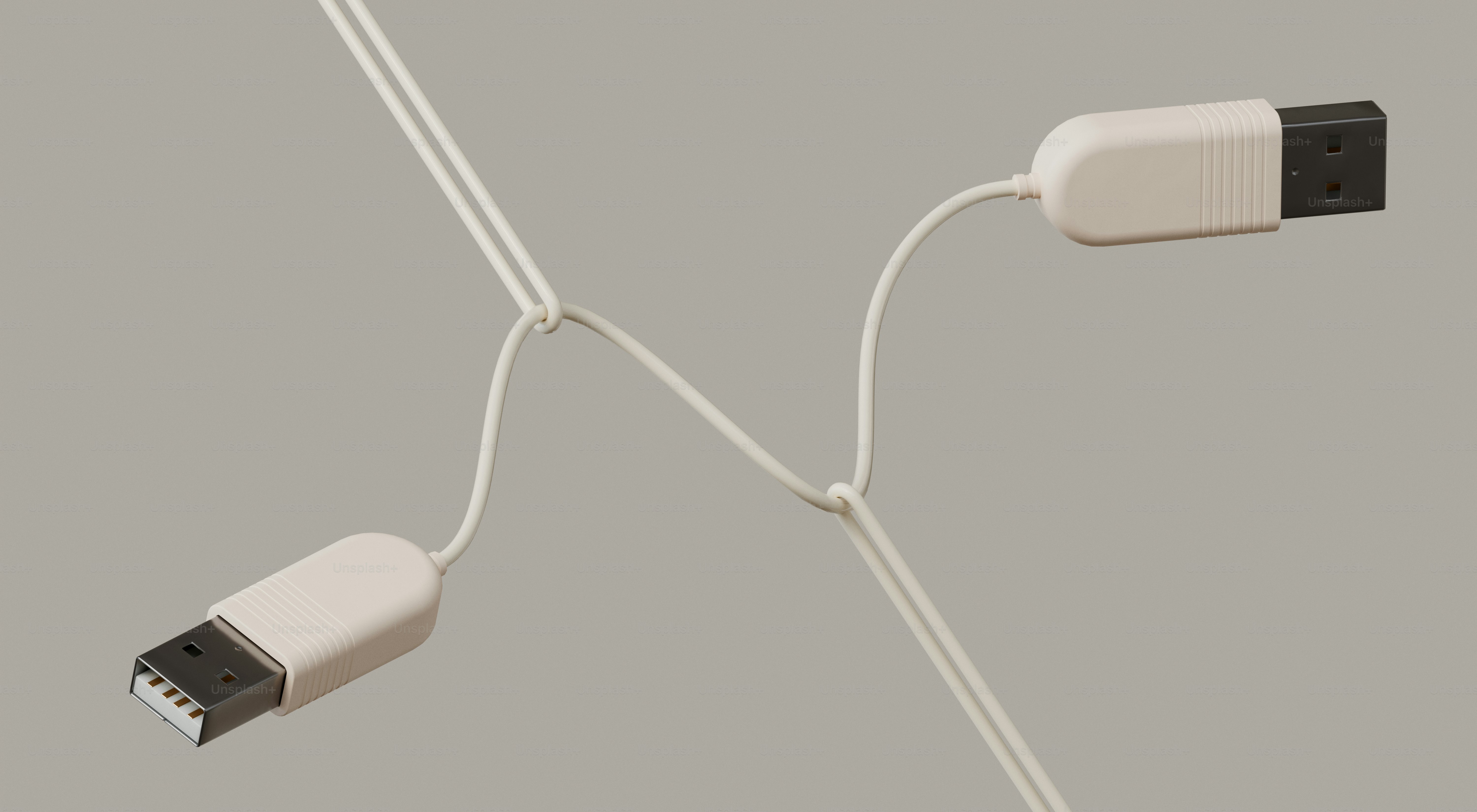 Dois cabos usb brancos em um fundo cinza