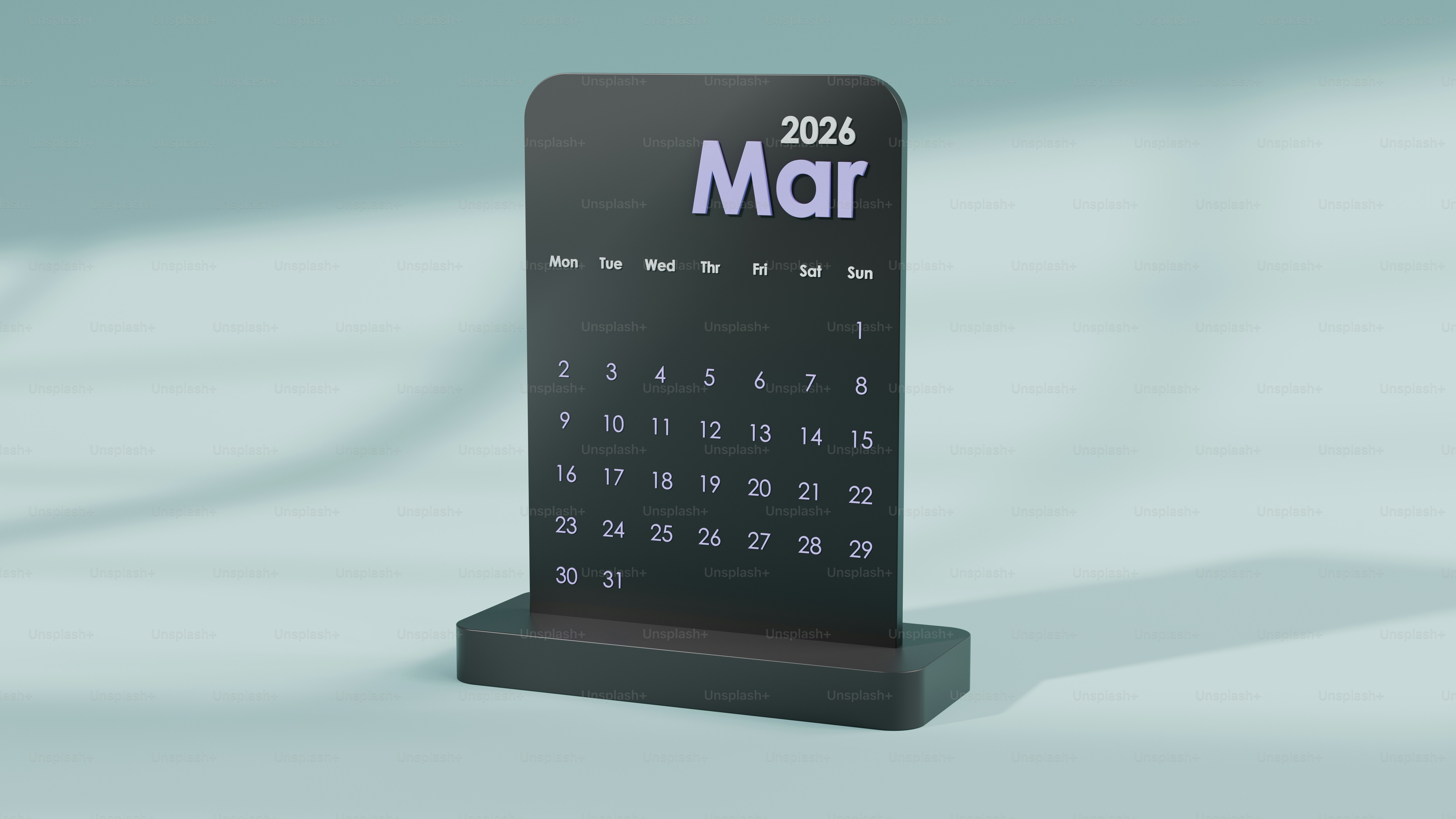 Black desk calendar showing march 2026