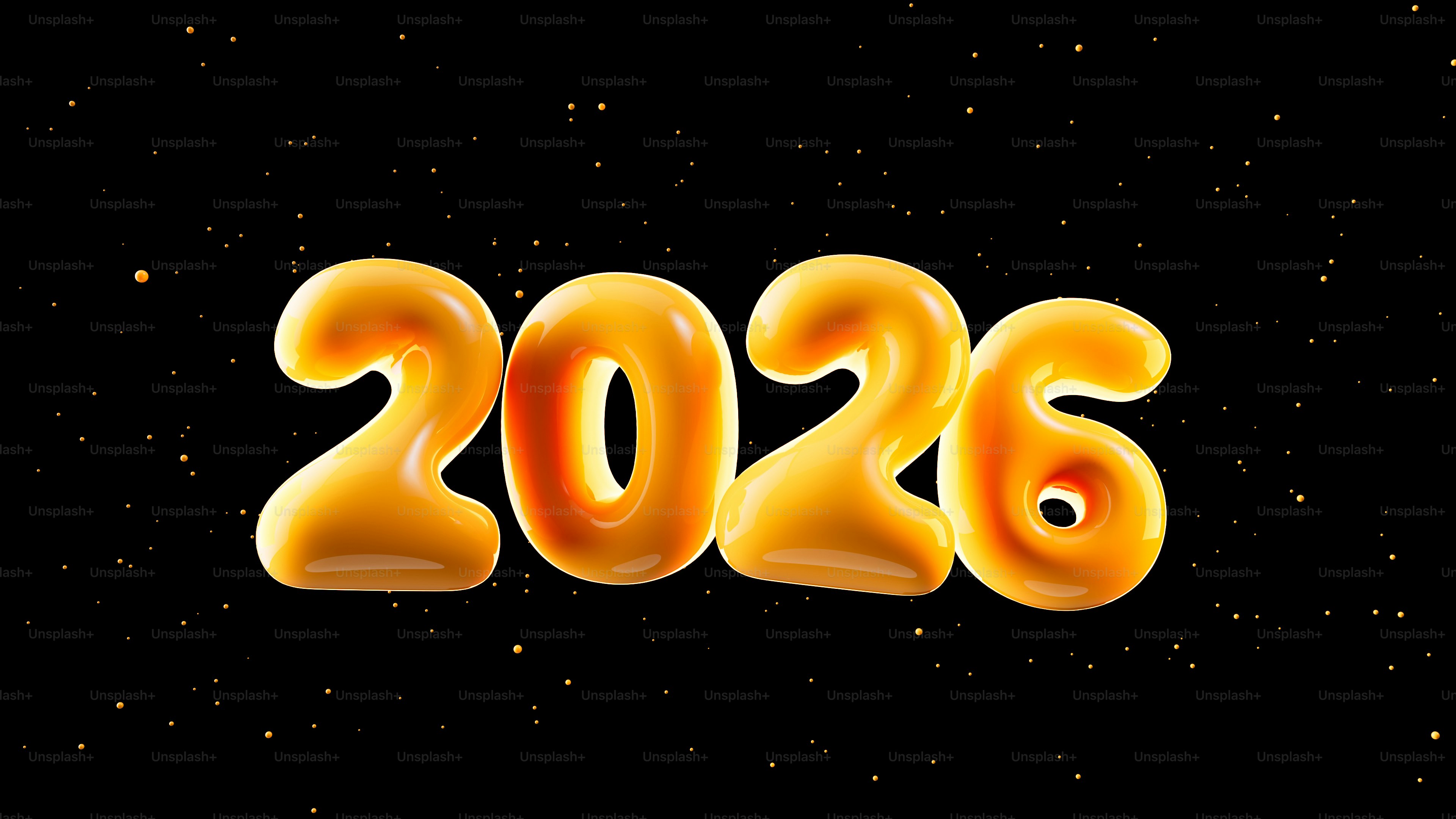 Des ballons dorés épelent 2026 avec des confettis.