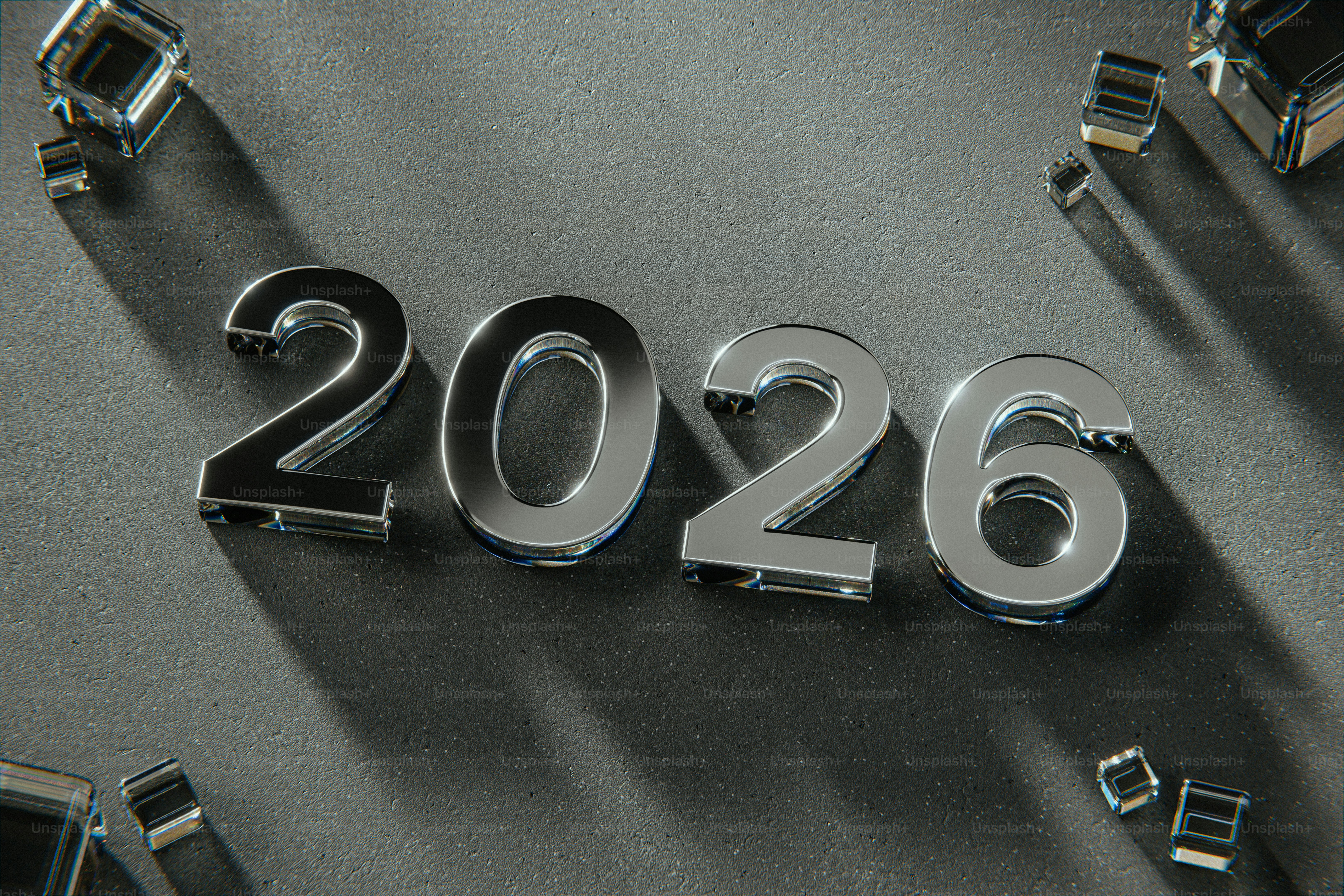 Shiny metallic 2026 numbers on dark background