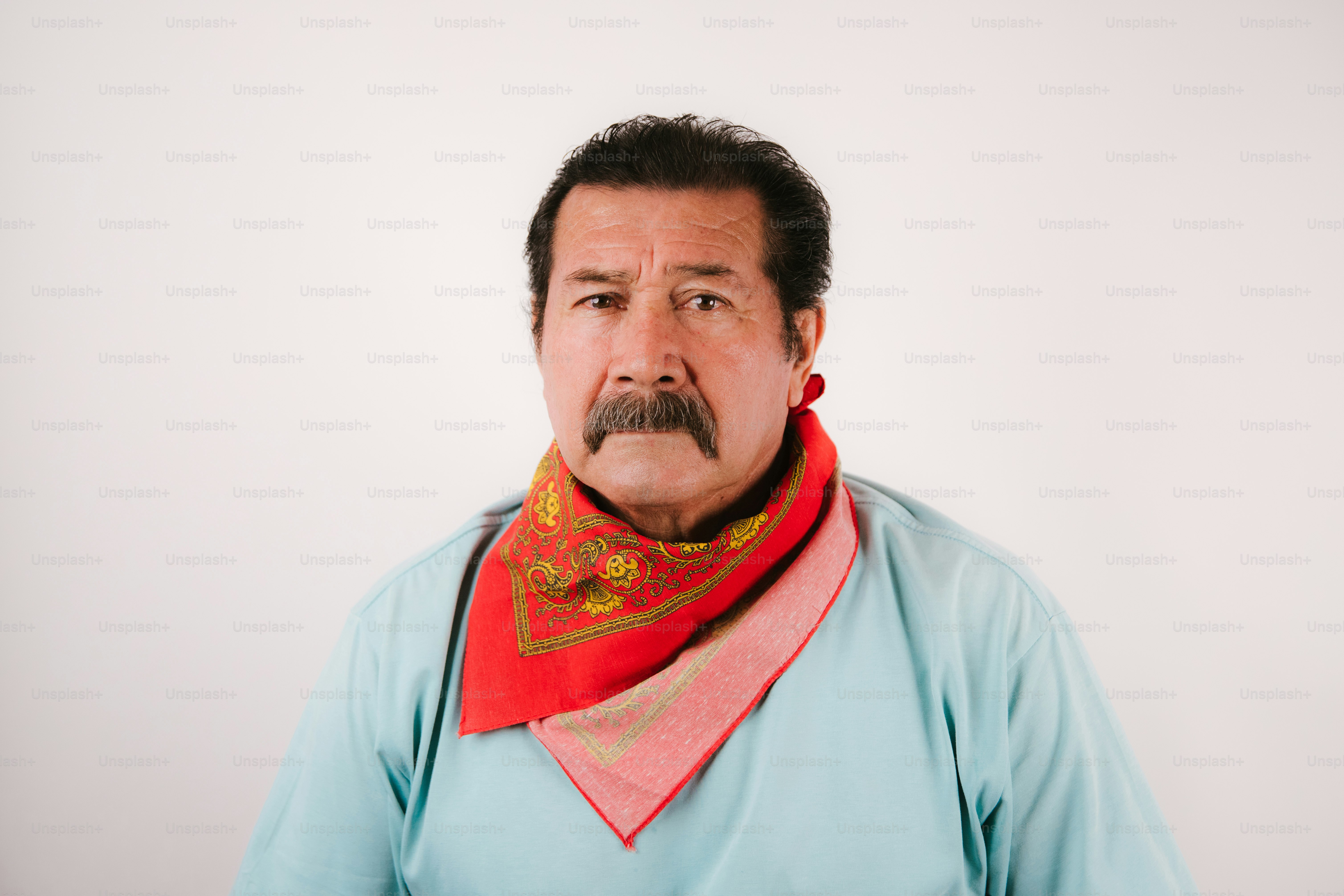 Man with mustache wearing a red bandana