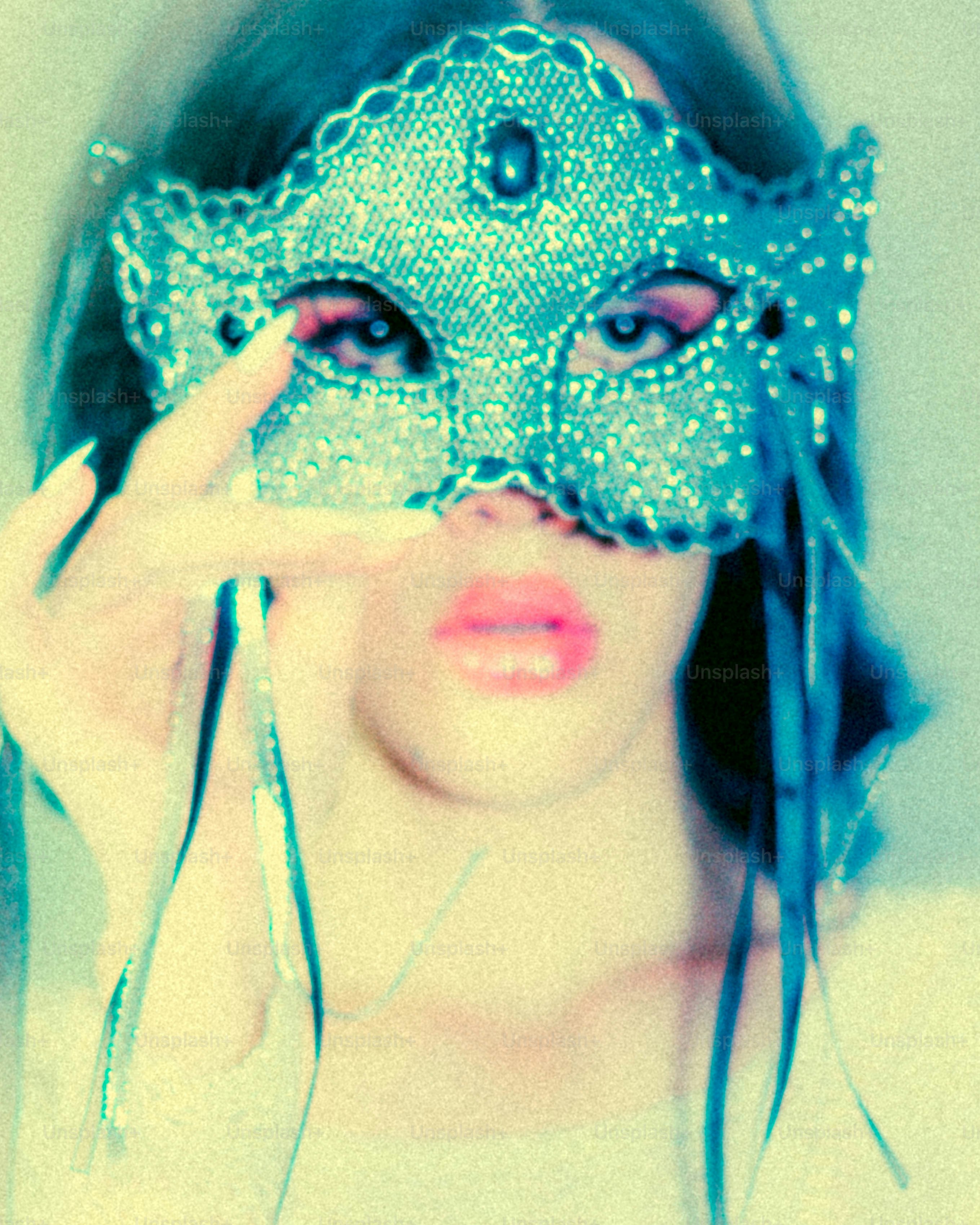 Woman wearing a sparkly blue masquerade mask
