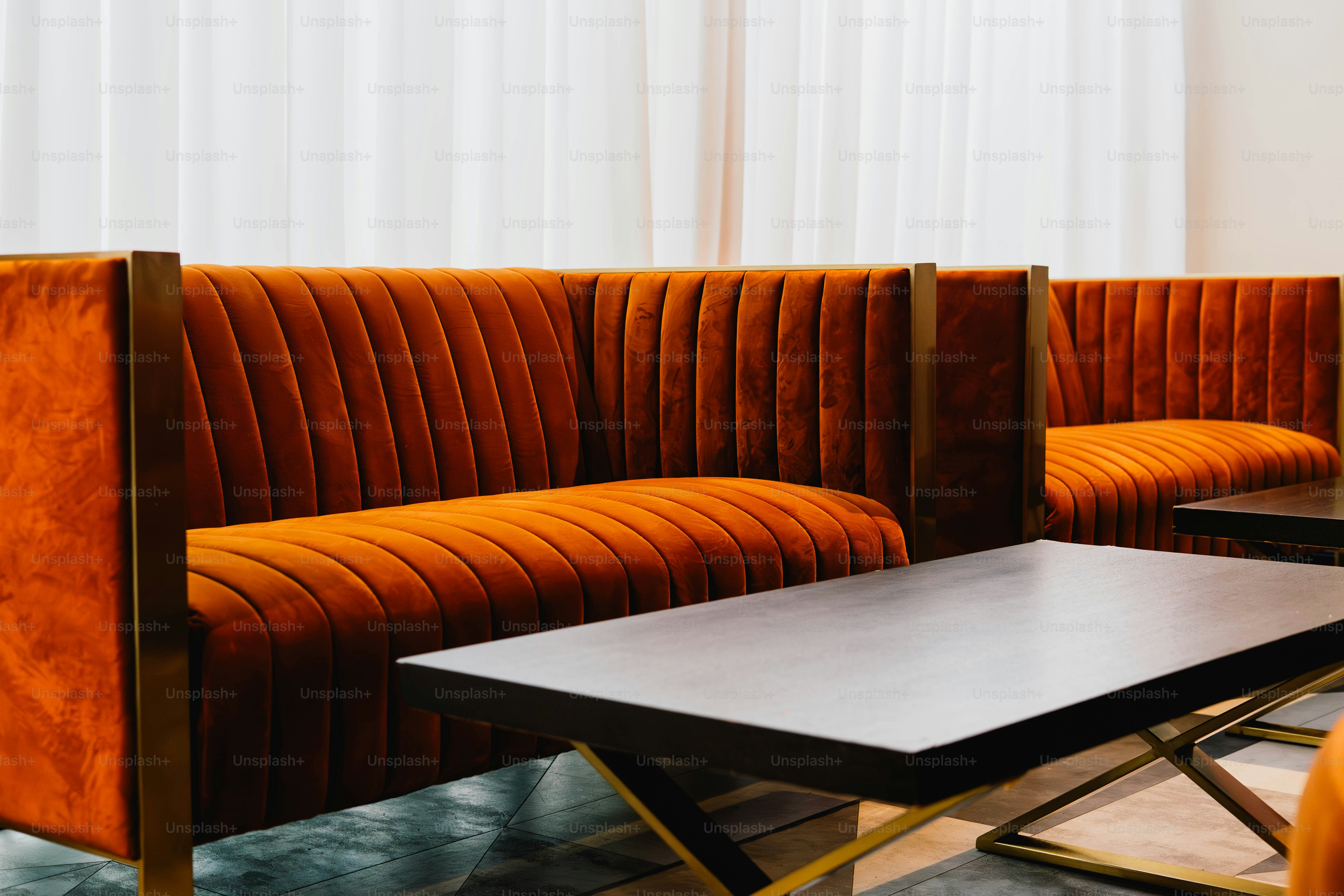 Orange velvet booths with dark wood tables photo – Interior design ...