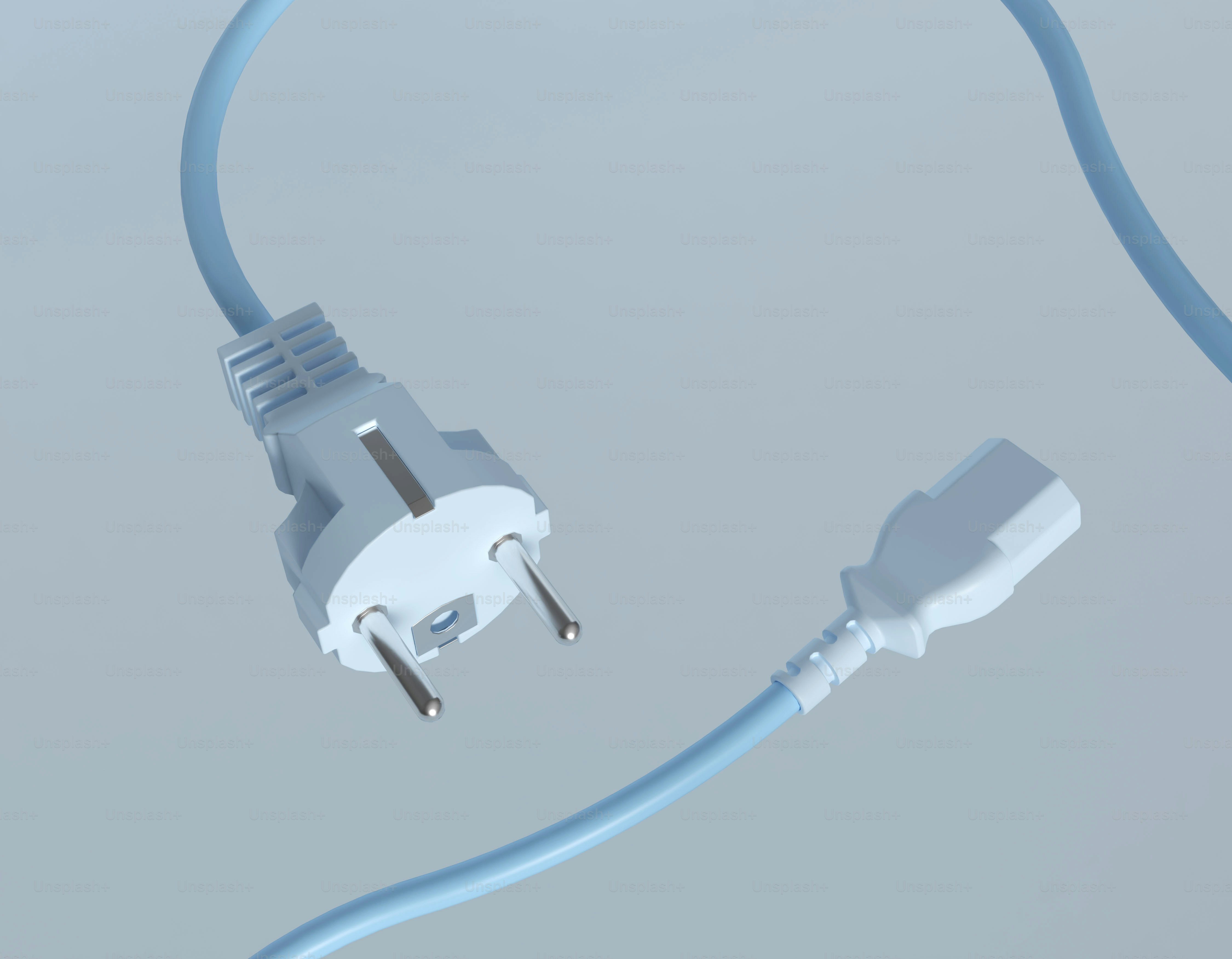 A white european plug and socket on a cord