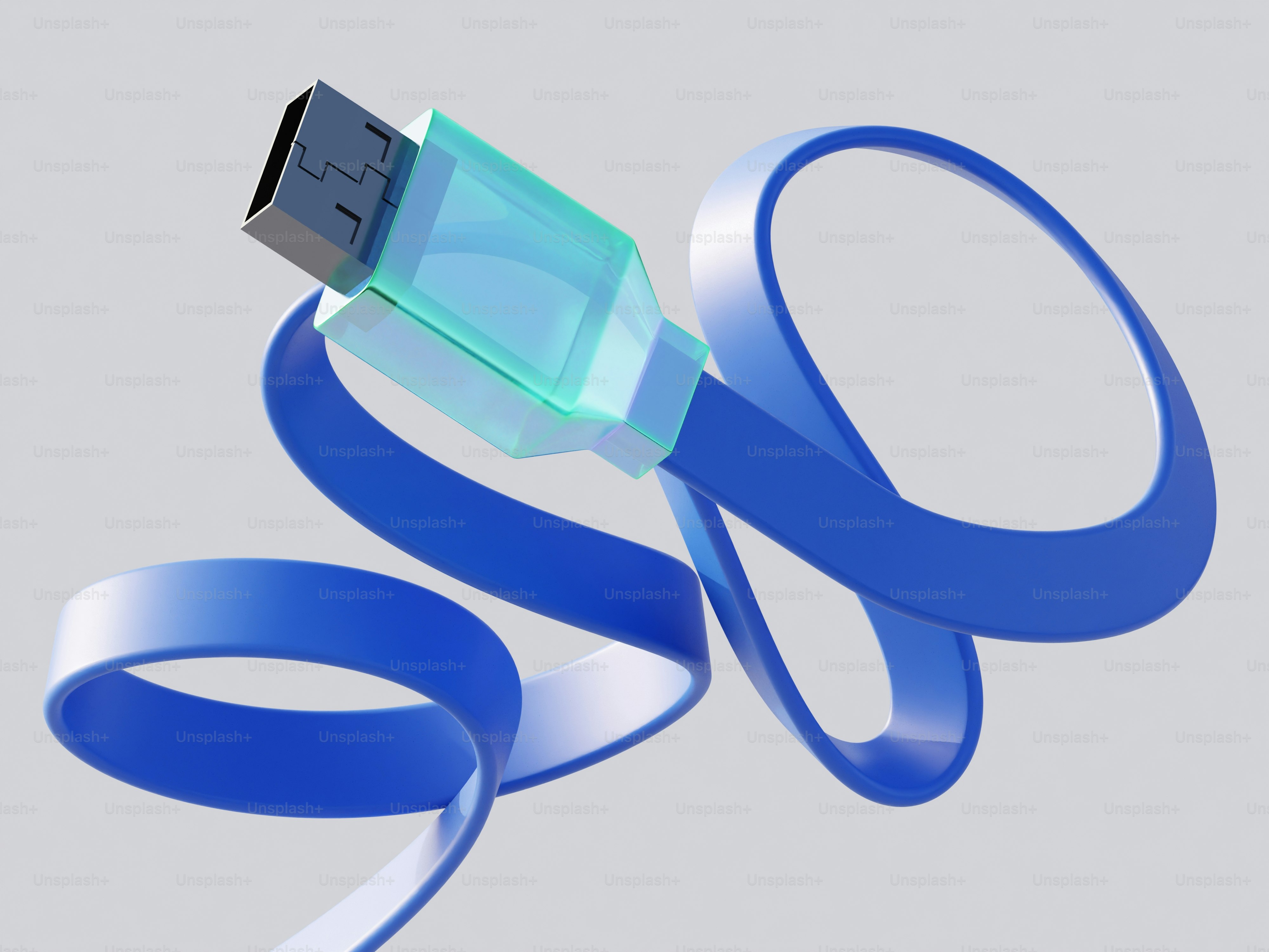 Un cable usb azul enrollado sobre un fondo gris.