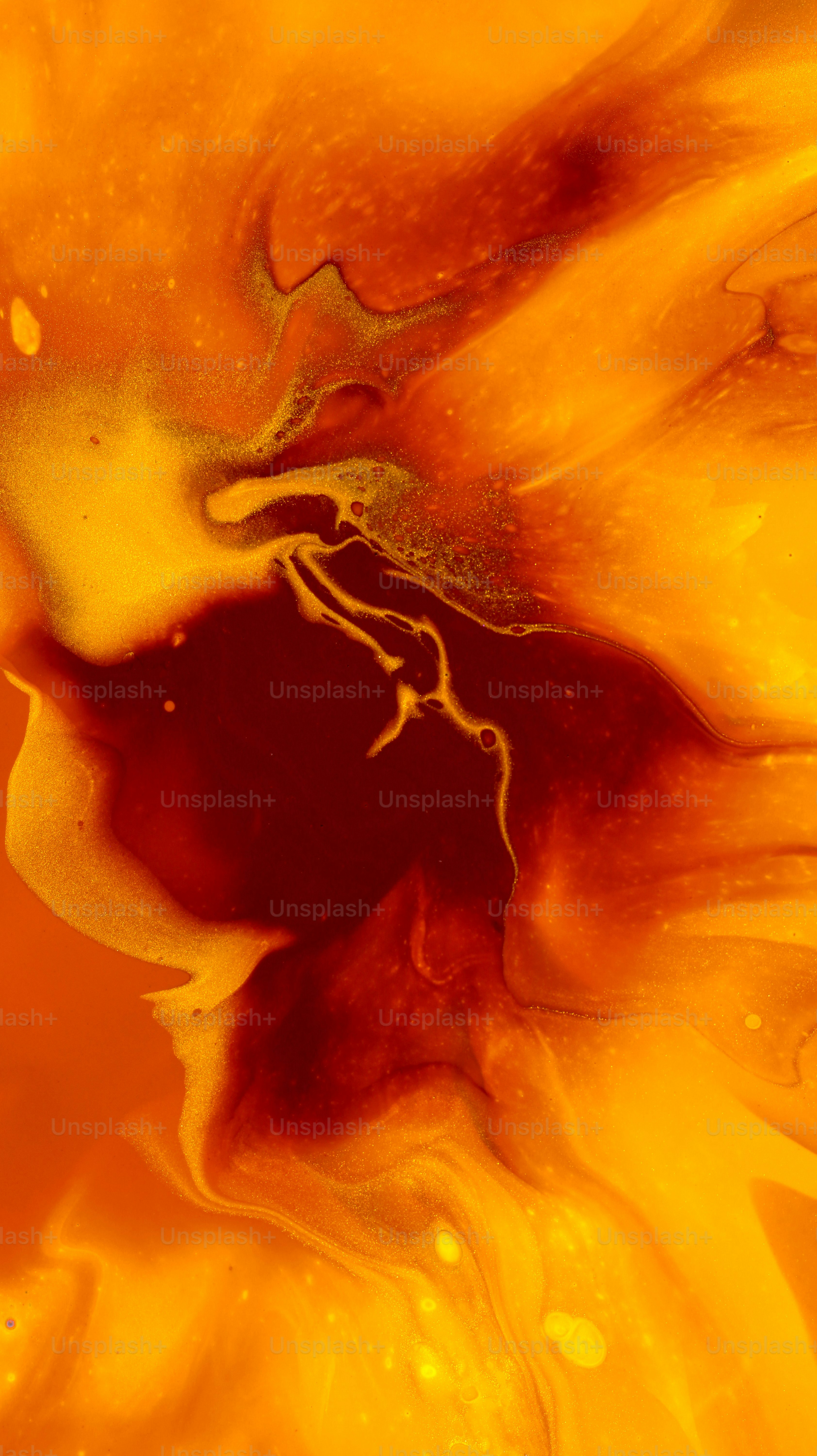 Abstract swirls of orange and red paint