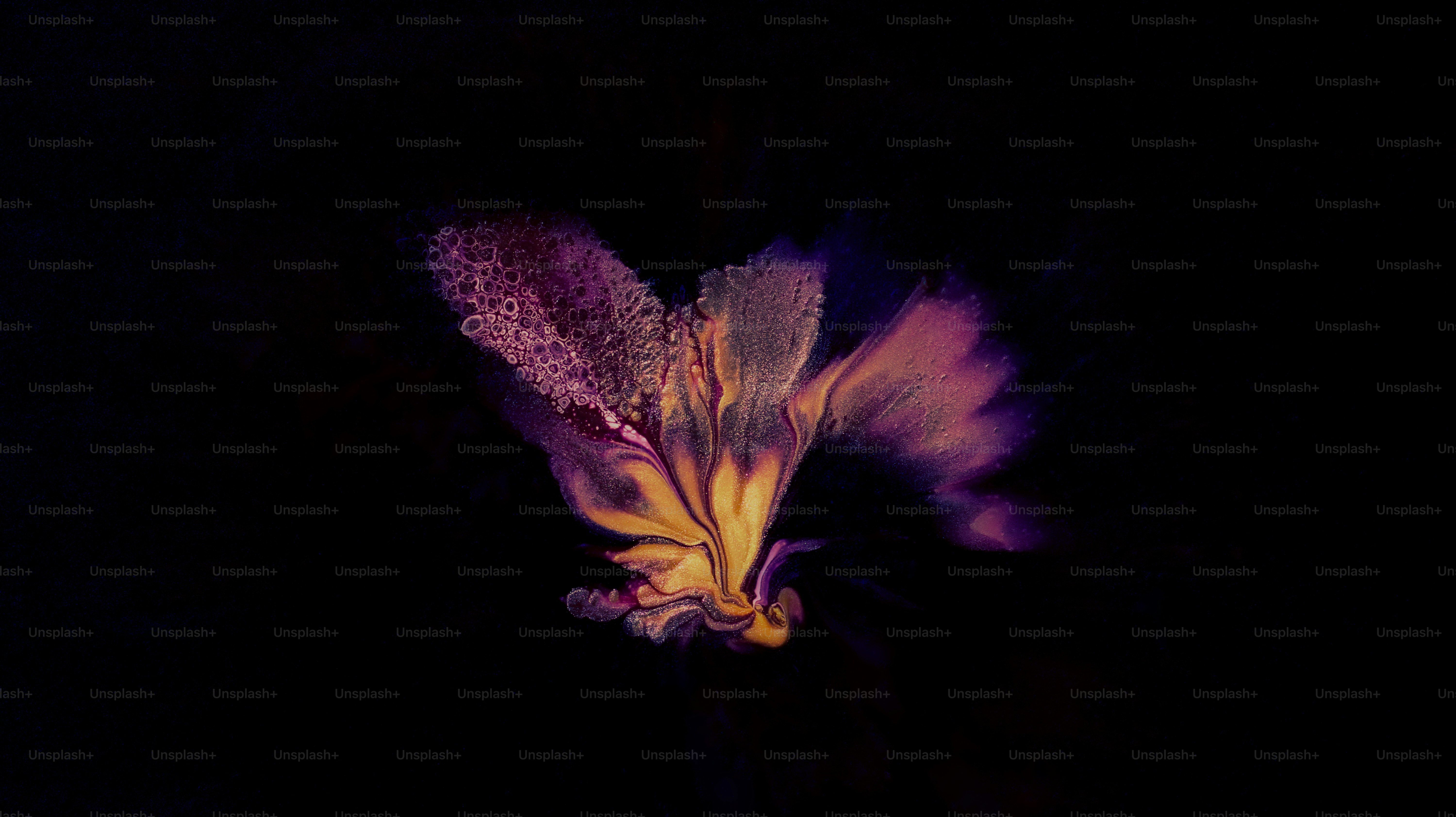 Abstract swirling colors against a dark background