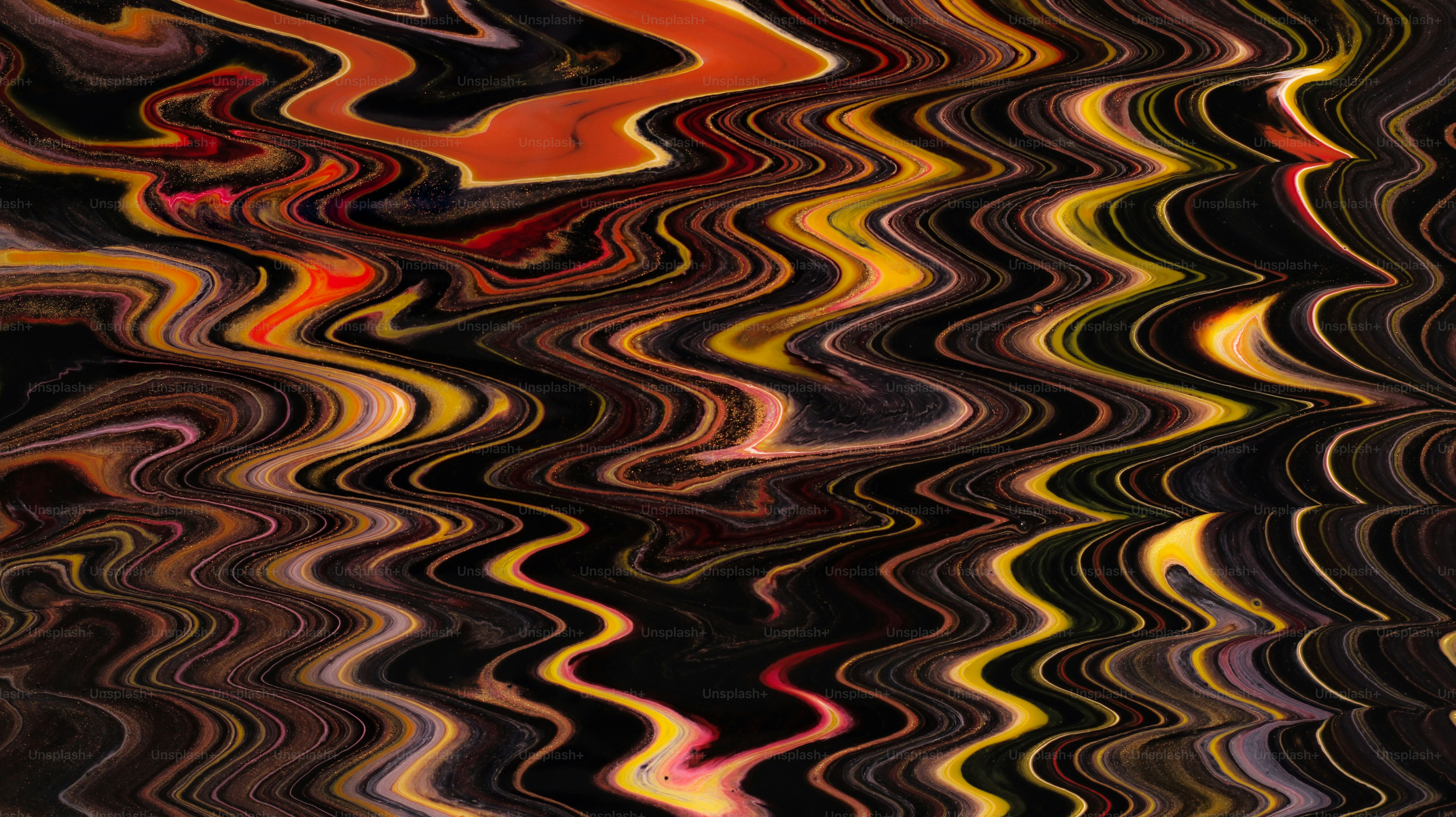Abstract wavy pattern with warm colors and dark background