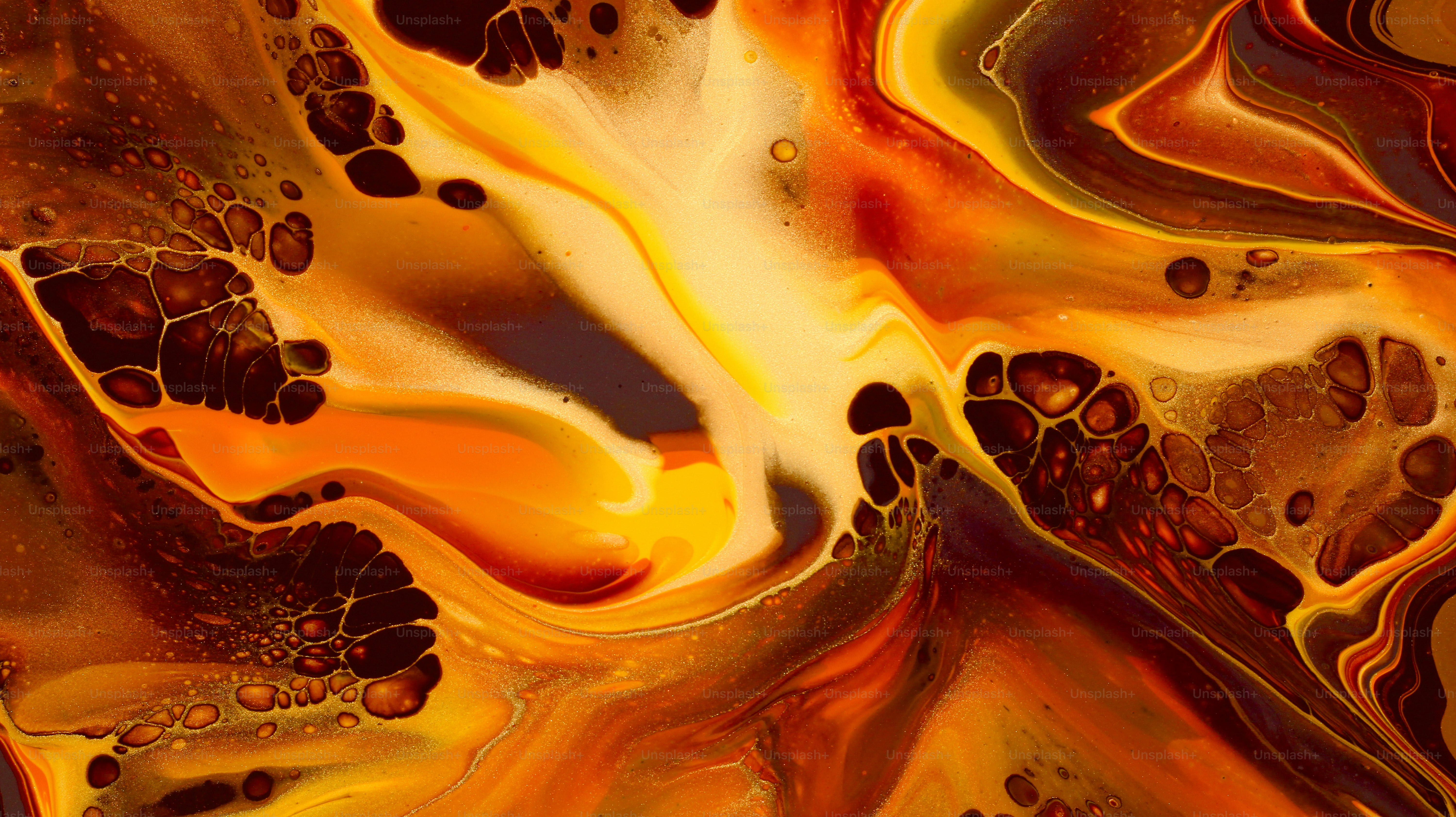 Abstract fluid art with warm colors and organic shapes.