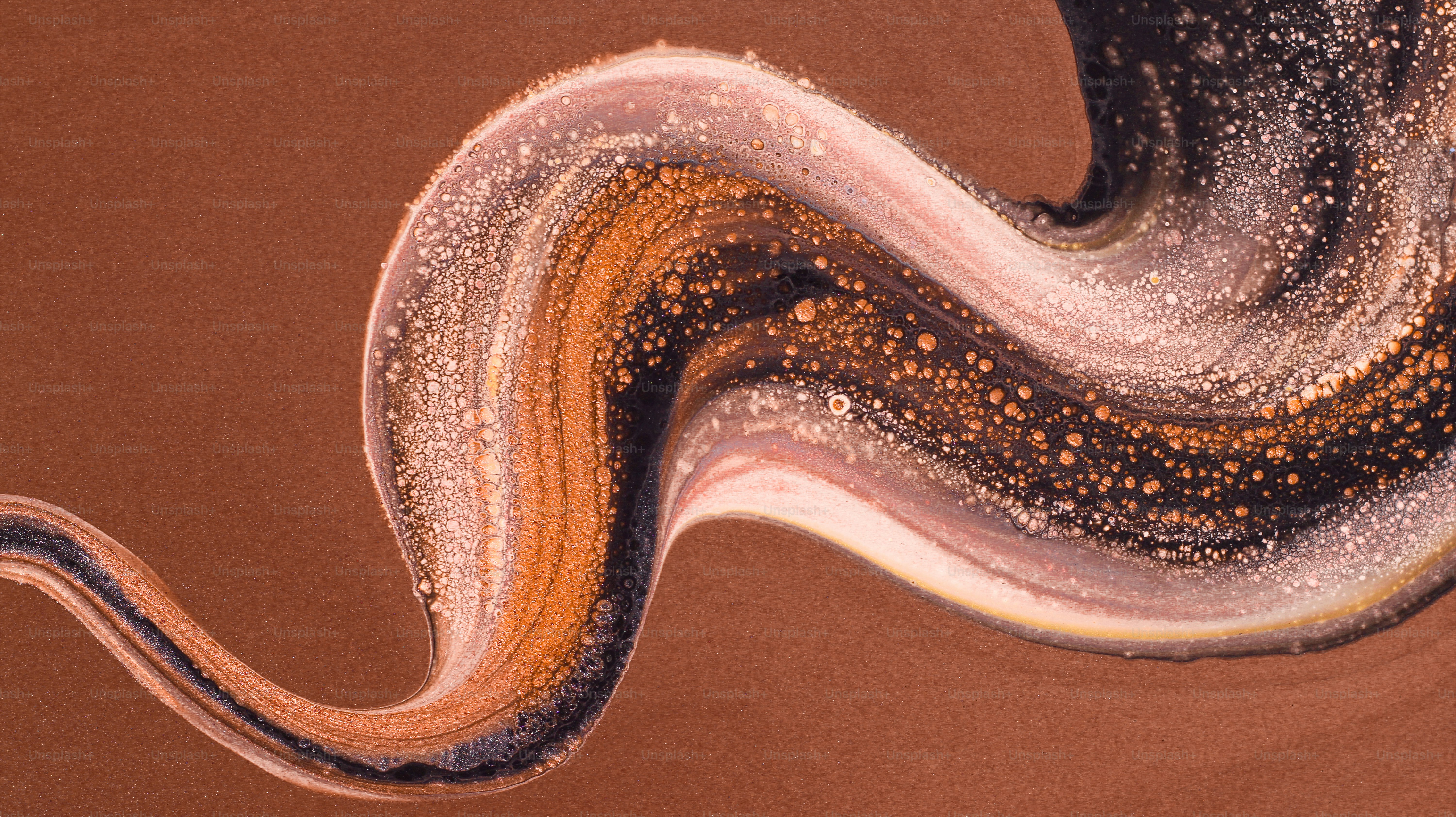 Abstract swirl of earthy colors with speckled texture