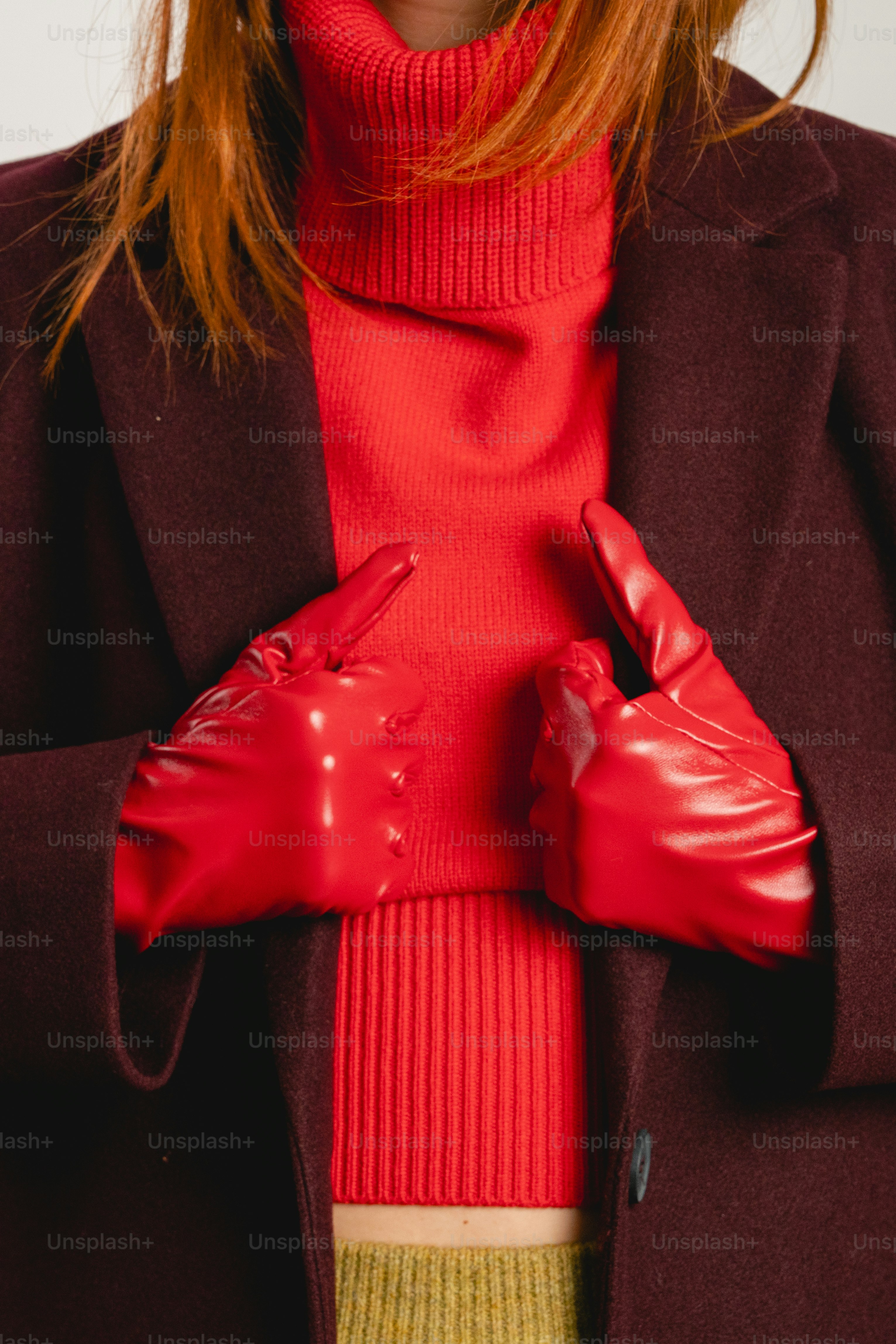Woman wearing red gloves and turtleneck with red turtleneck