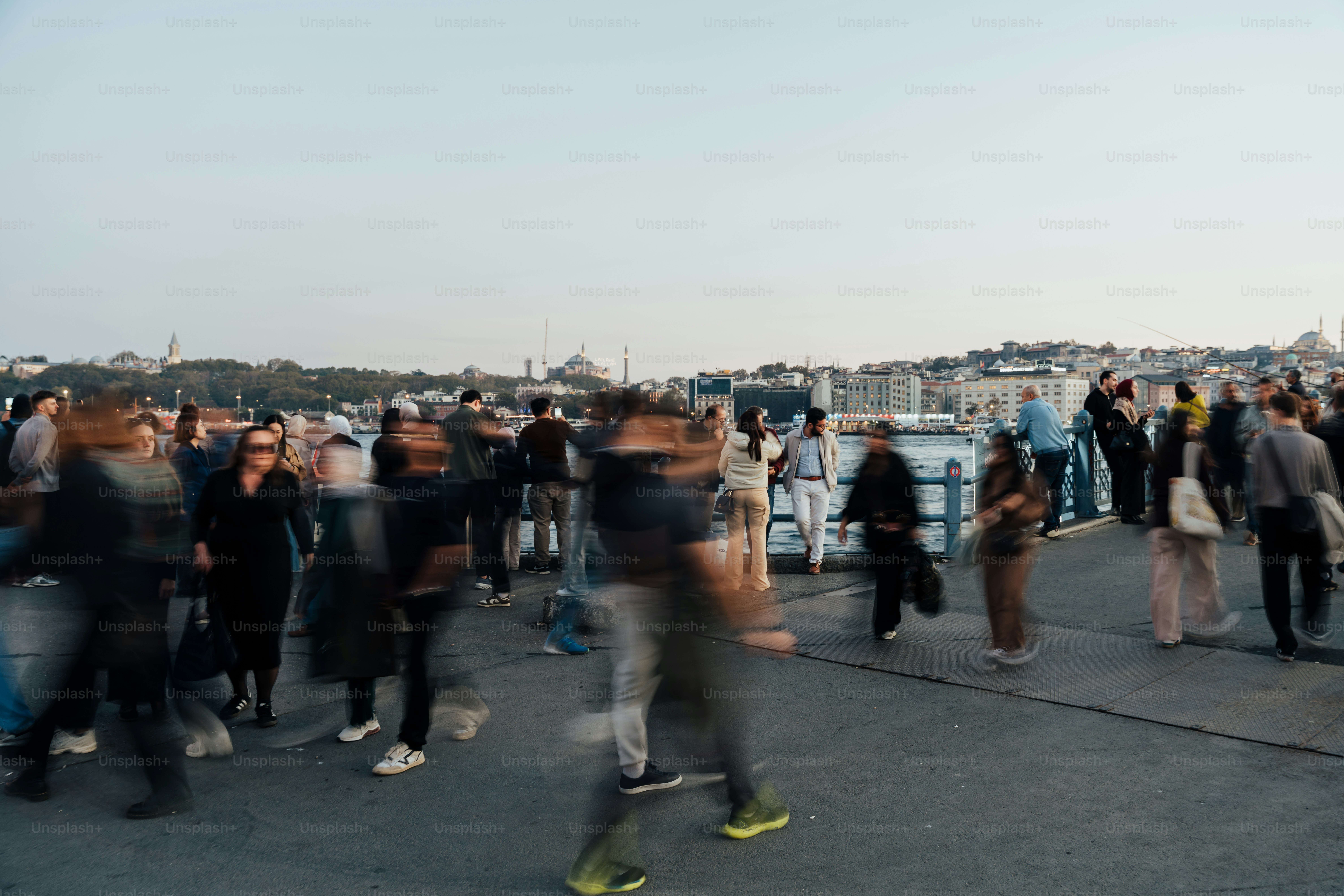 Blurred crowd of people walking on a street