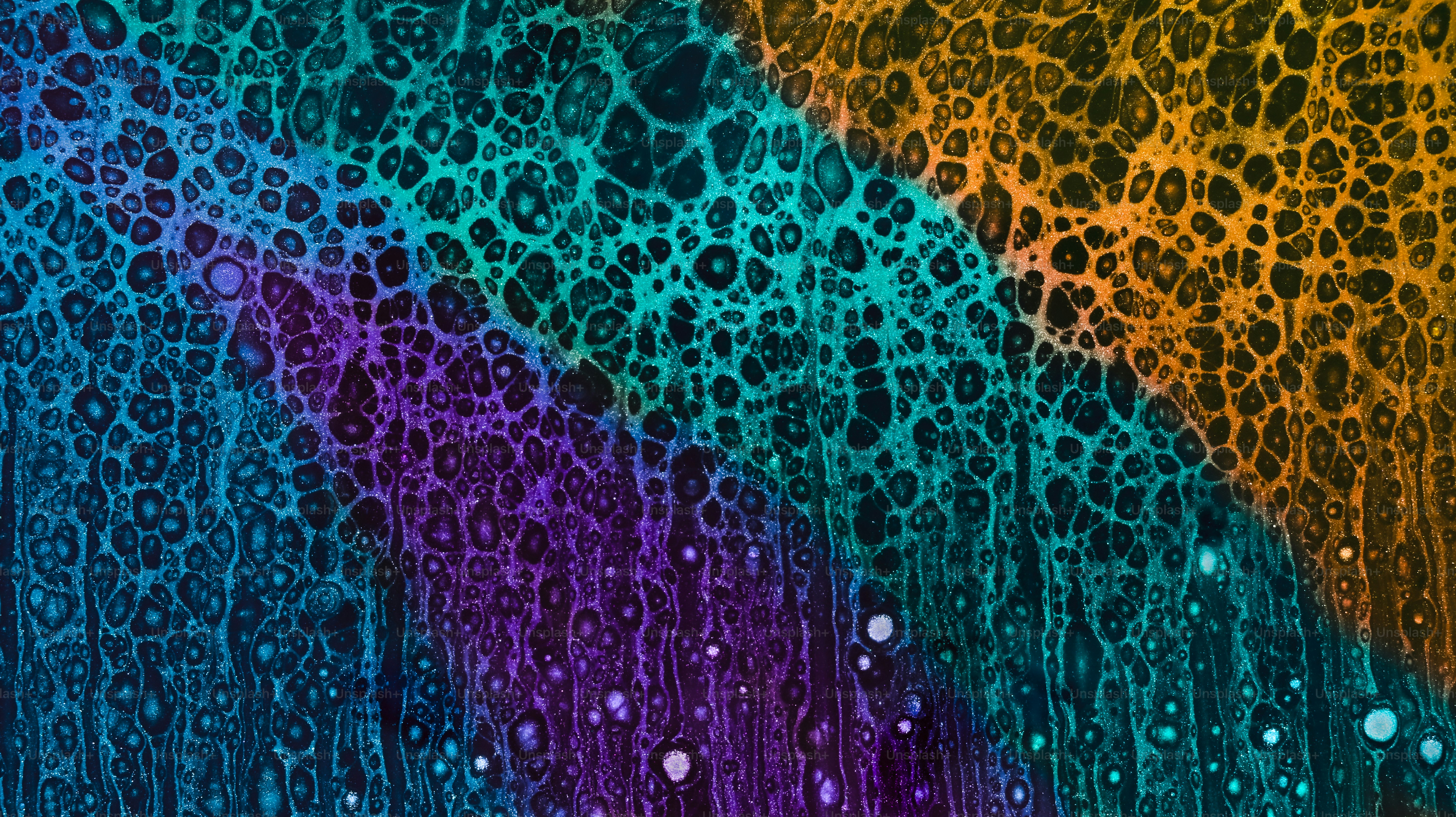 Abstract colorful fluid art with cells and textures.