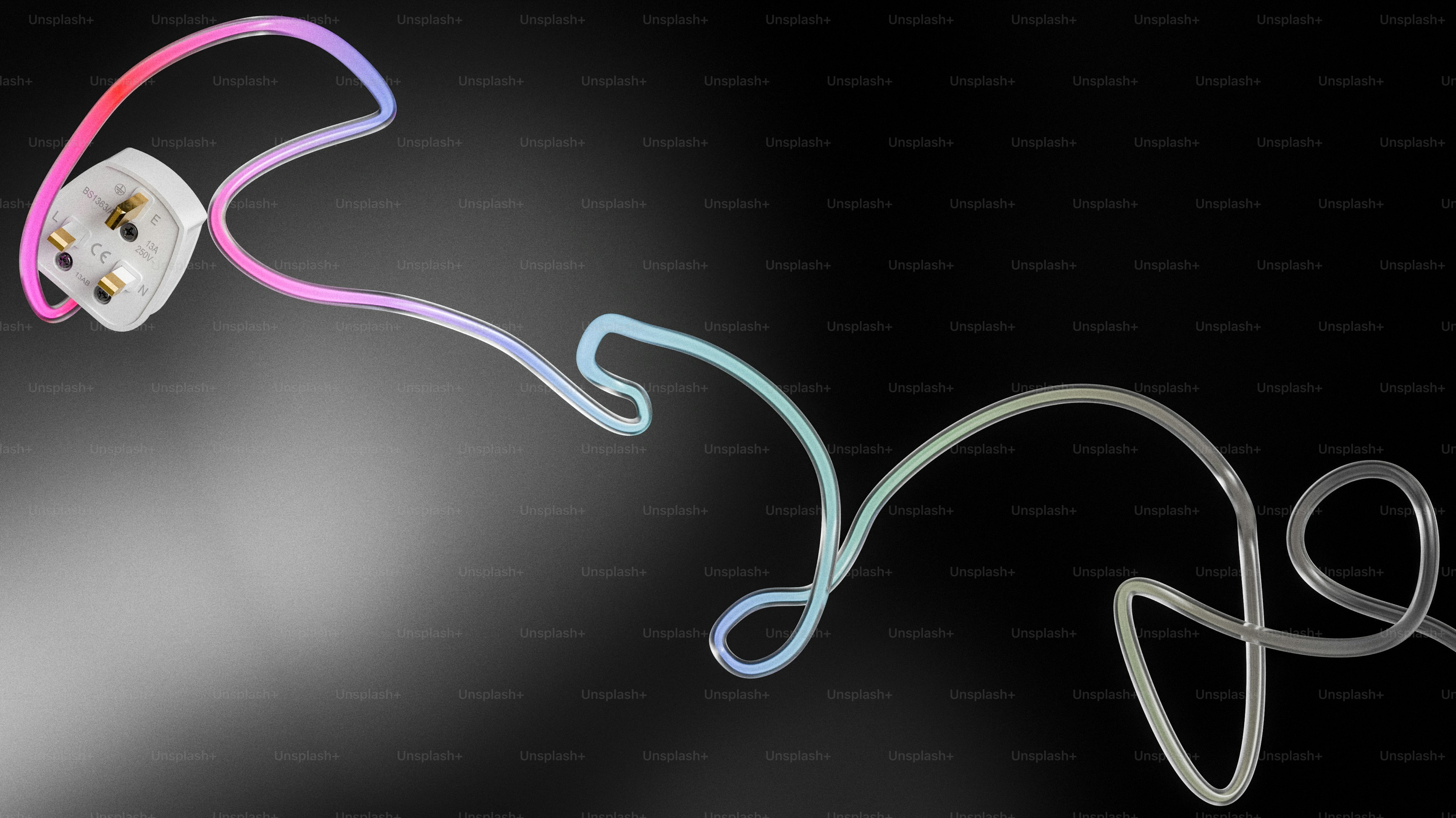 A power cord with a plug illuminated by colored lights.