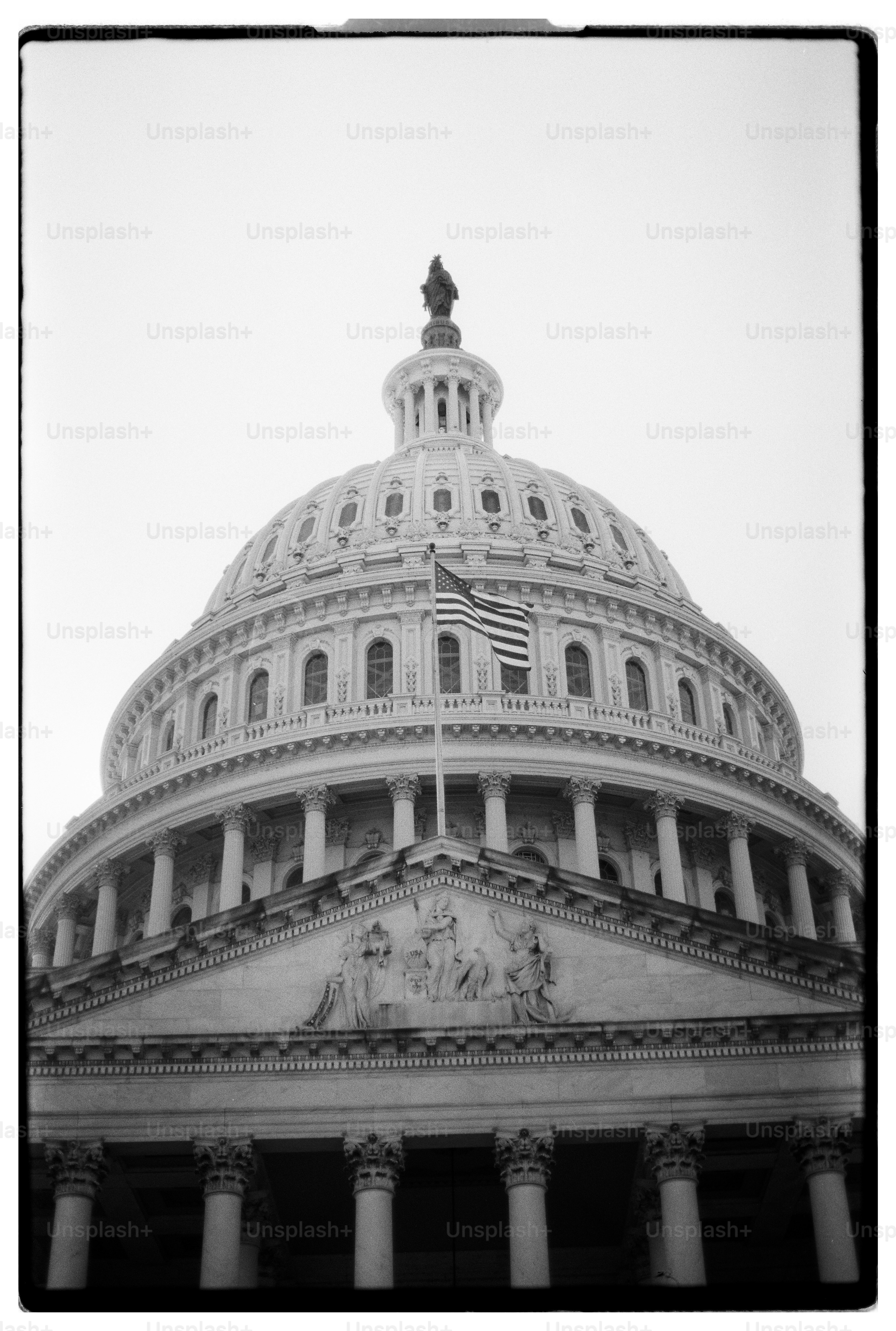 The united states capitol building dome with flag