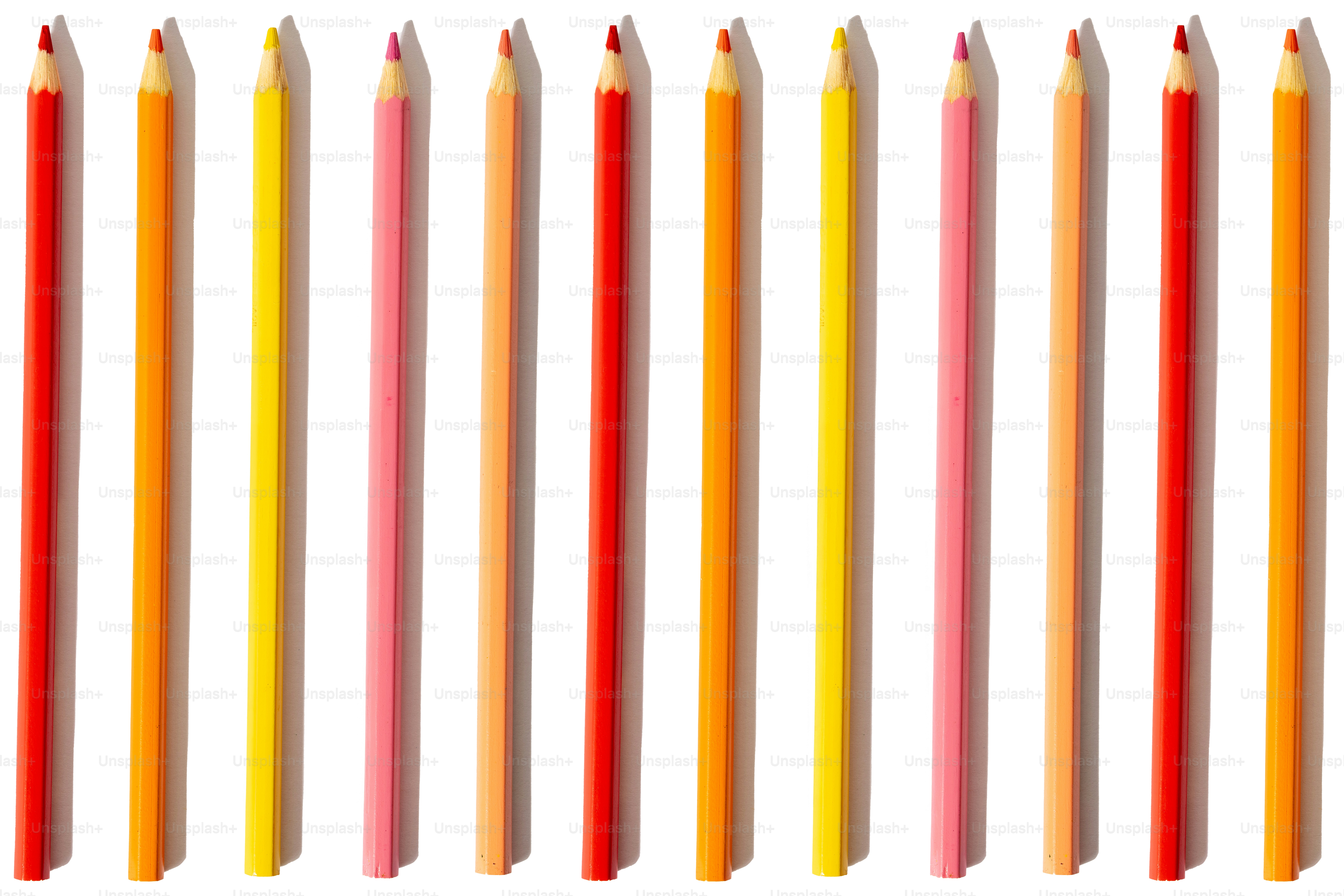 A row of colored pencils on a white background