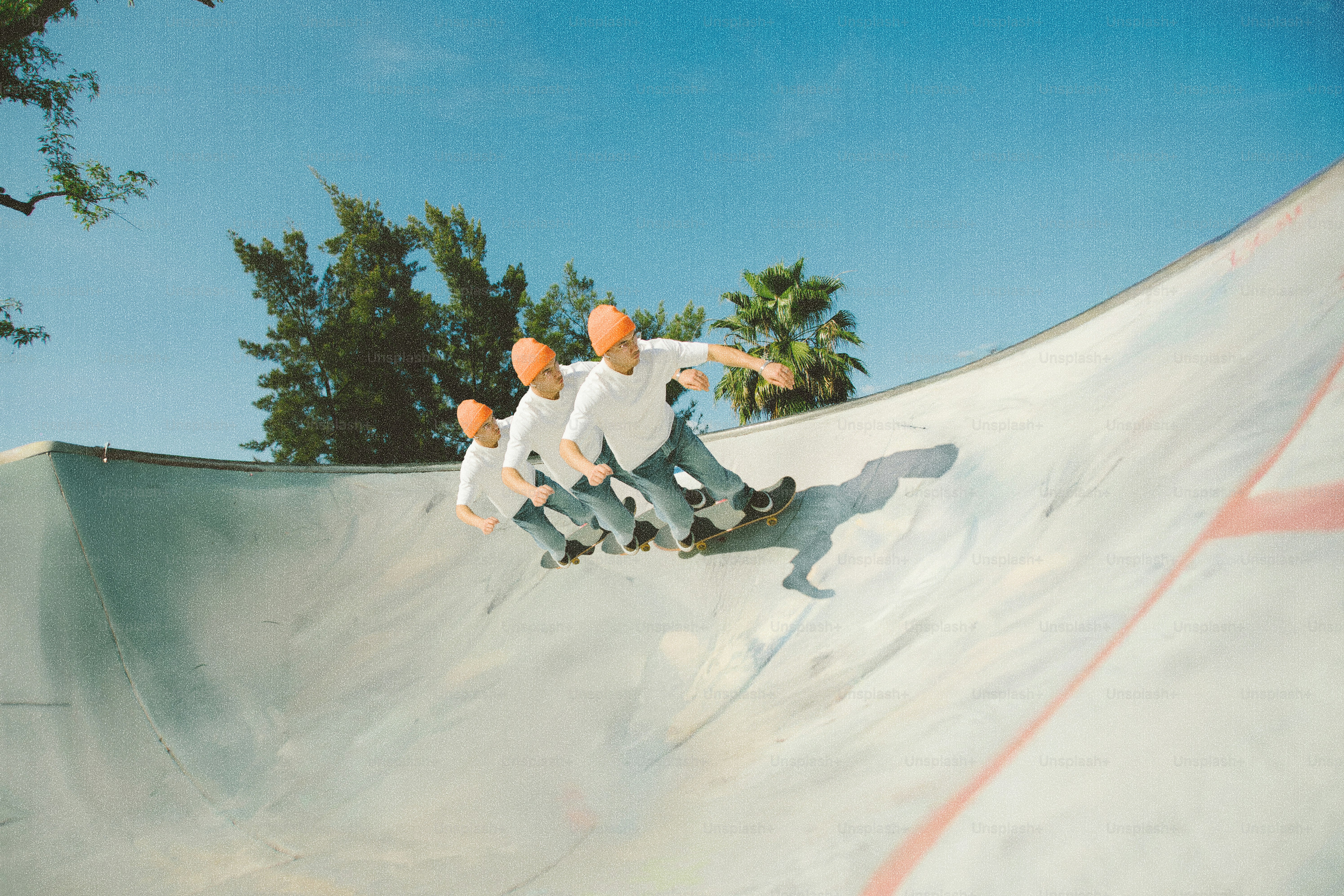 Skateboarder in a skatepark with multiple exposures.