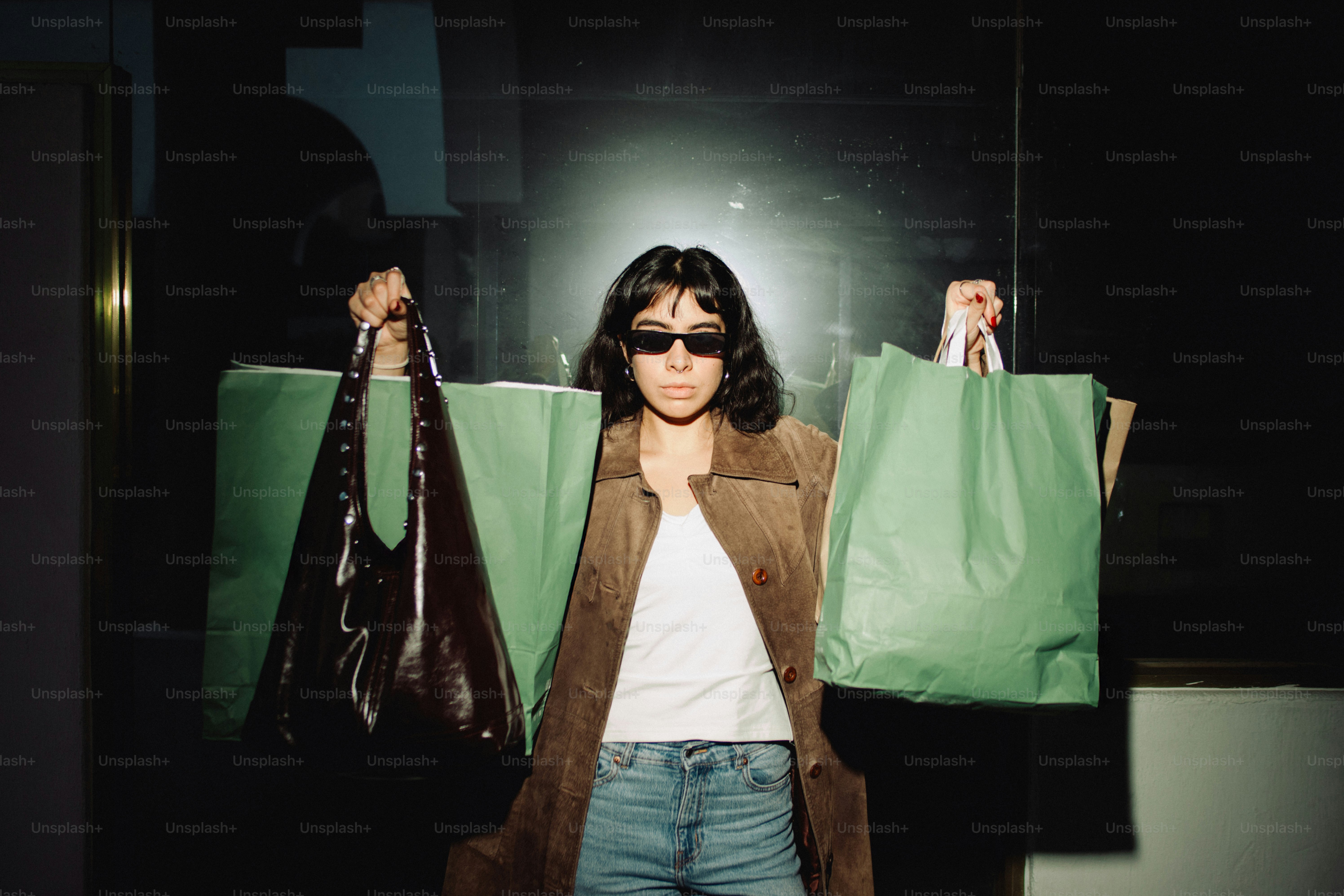 Woman holding shopping bags with sunglasses