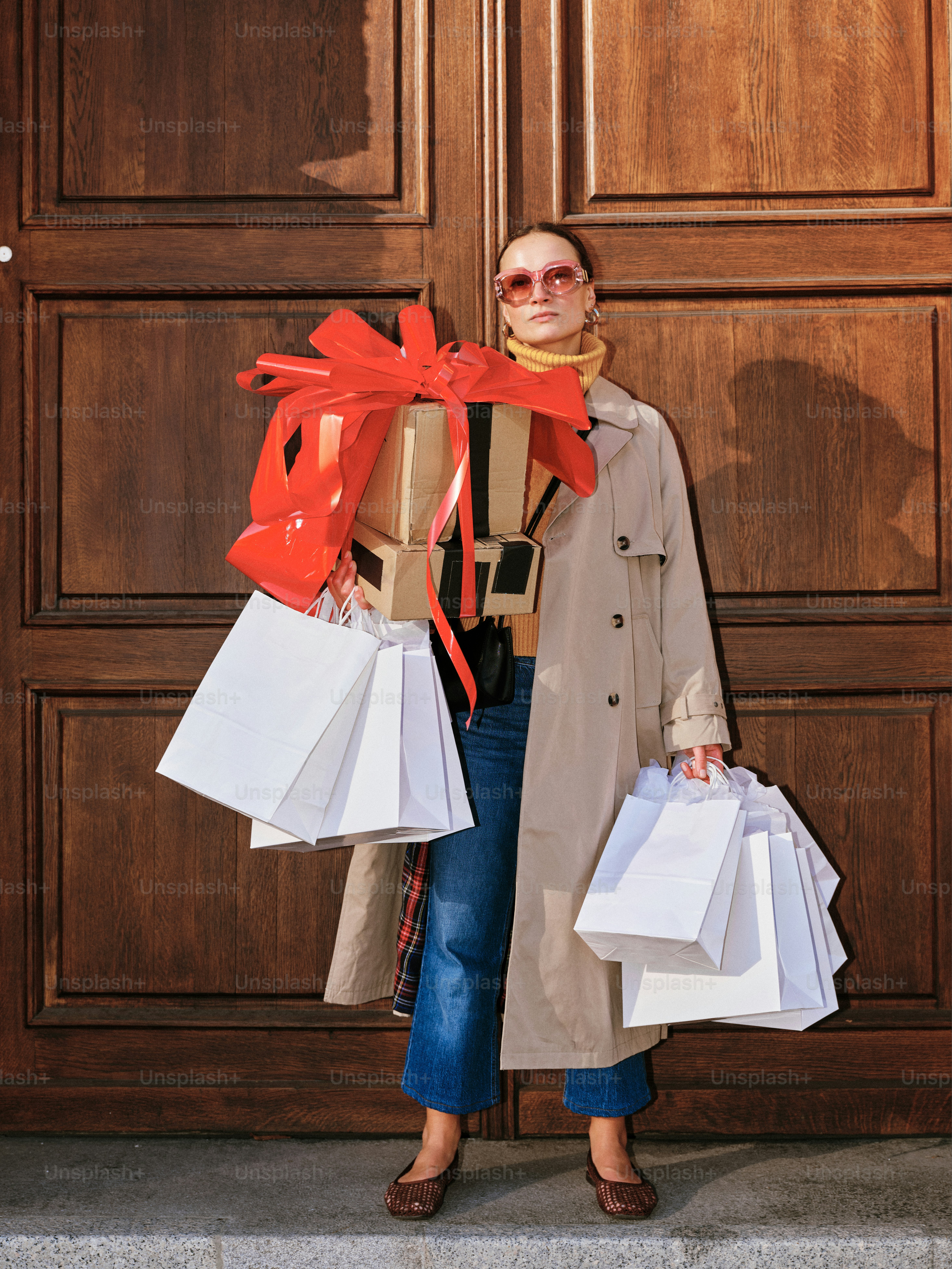 Woman with many shopping bags and gifts