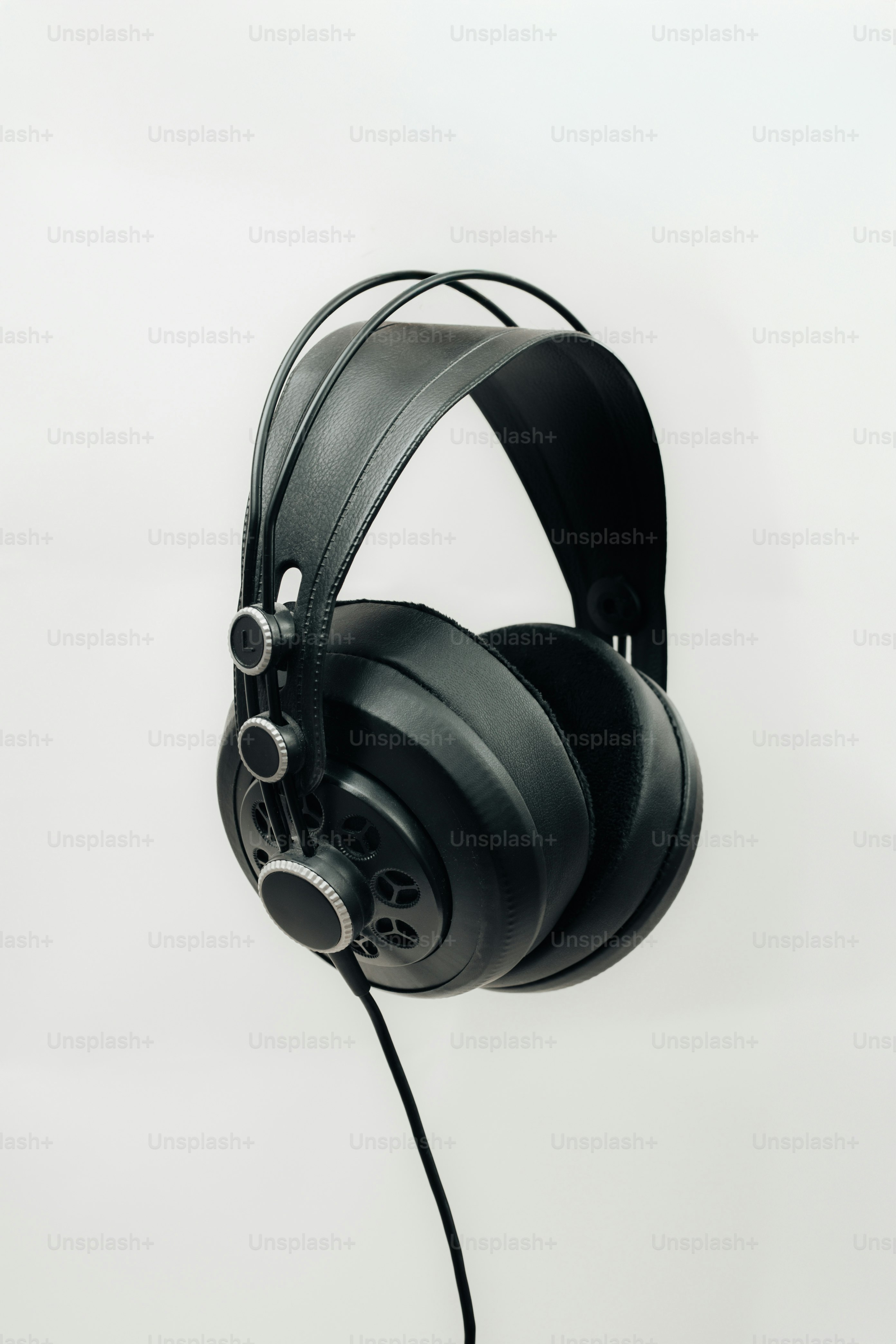 Black studio headphones on a white background