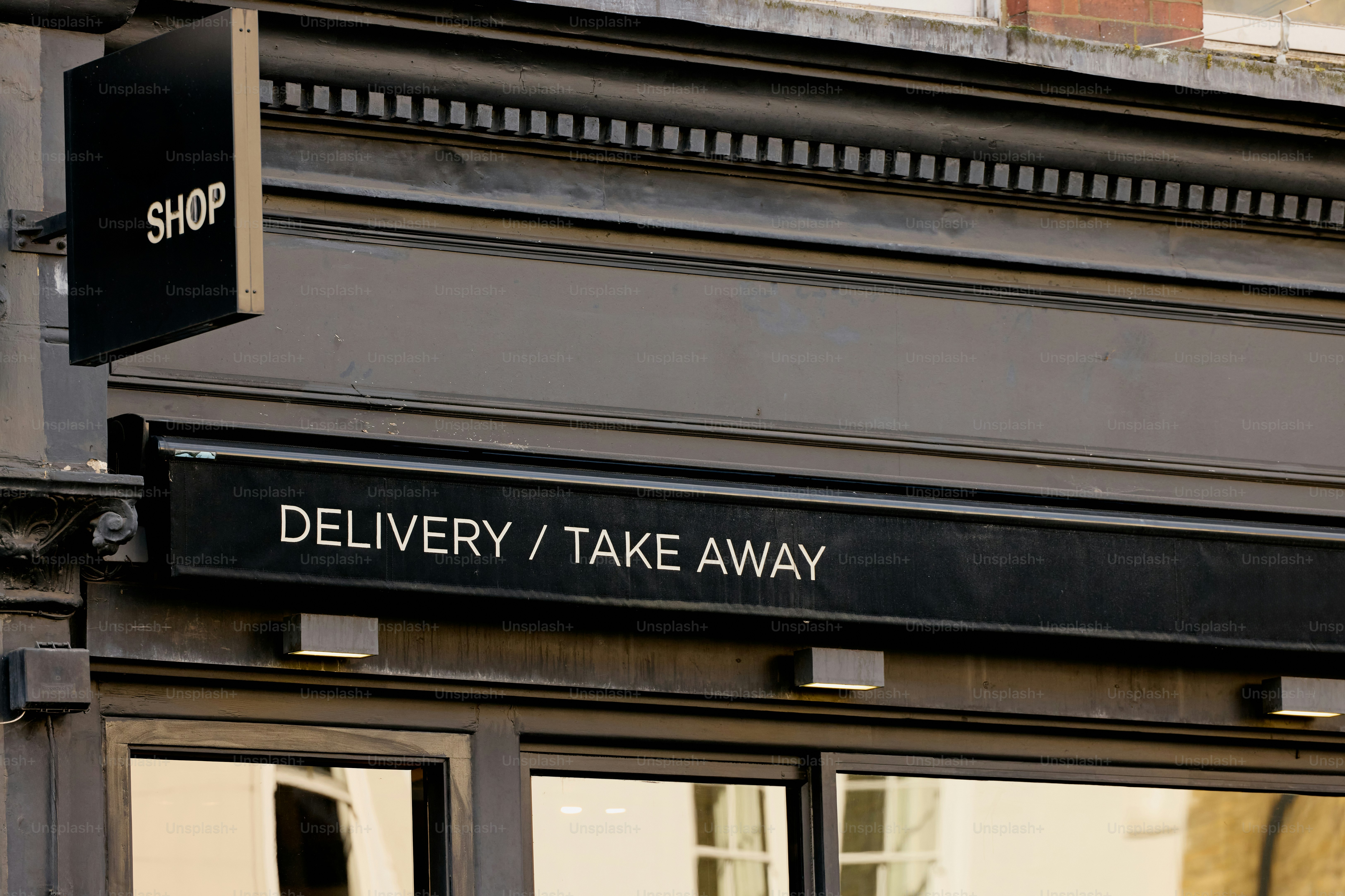Shop sign for delivery and take away services.