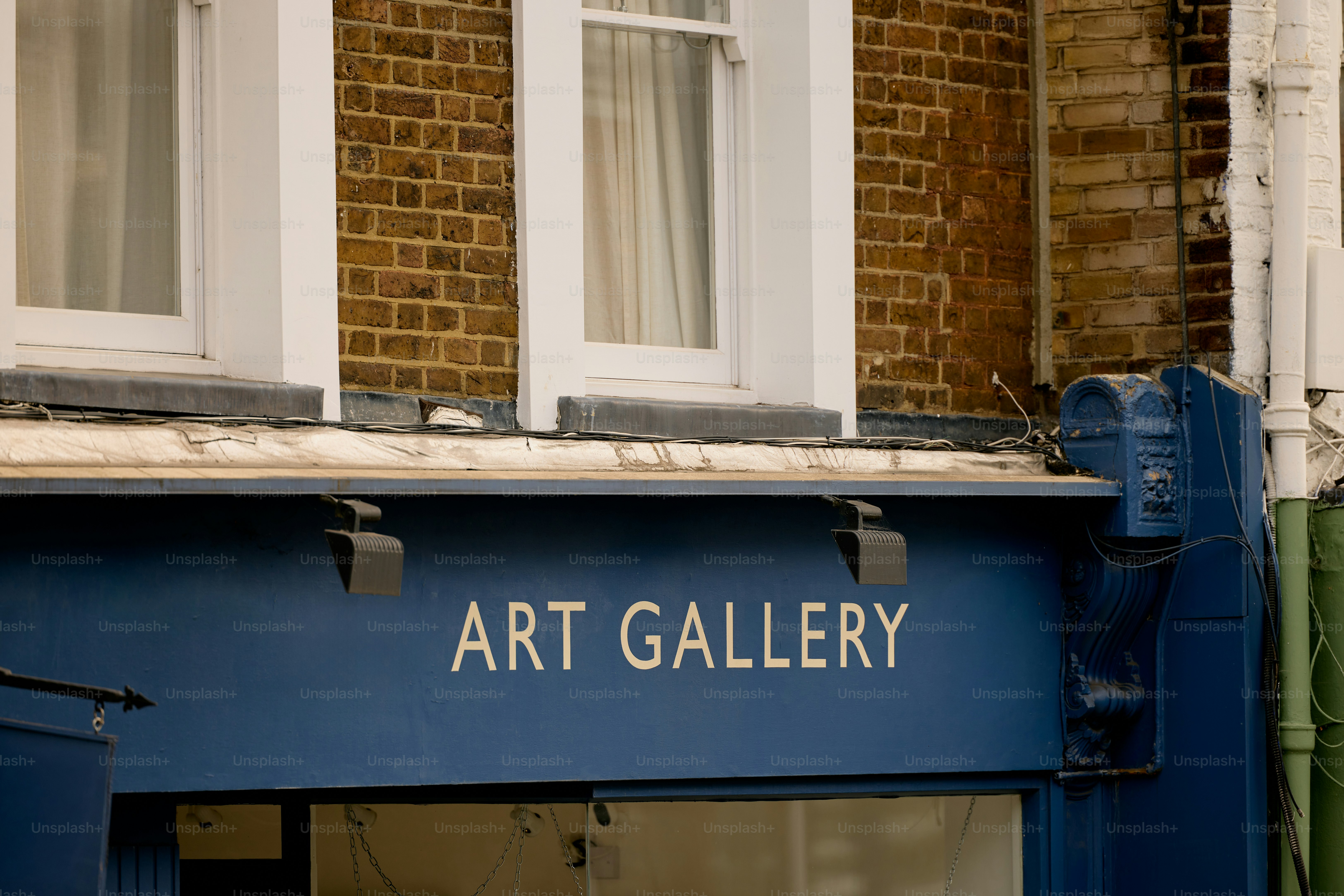 Art gallery storefront with brick building facade