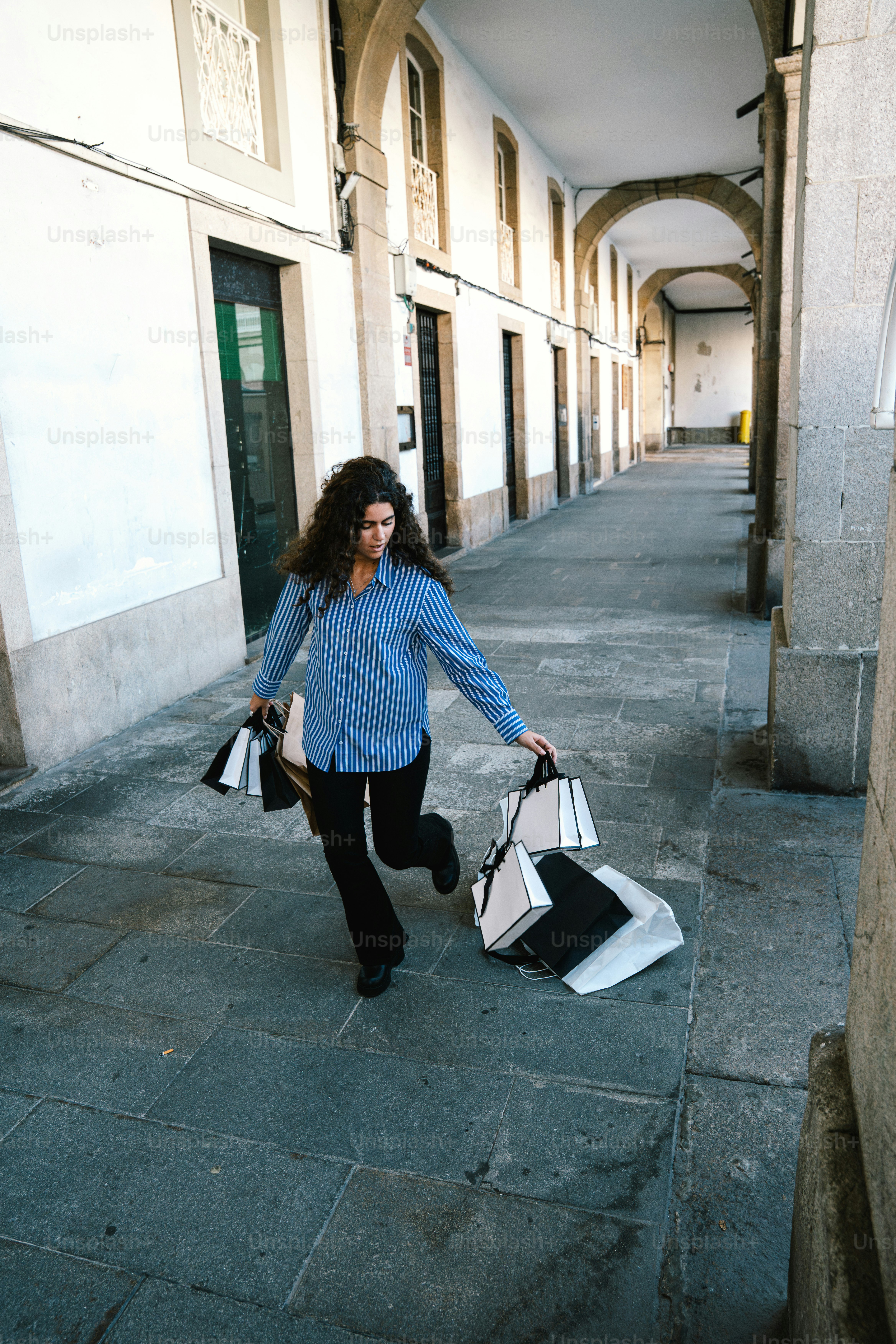 Person running with packages and a folder photo – Shopping Image on ...