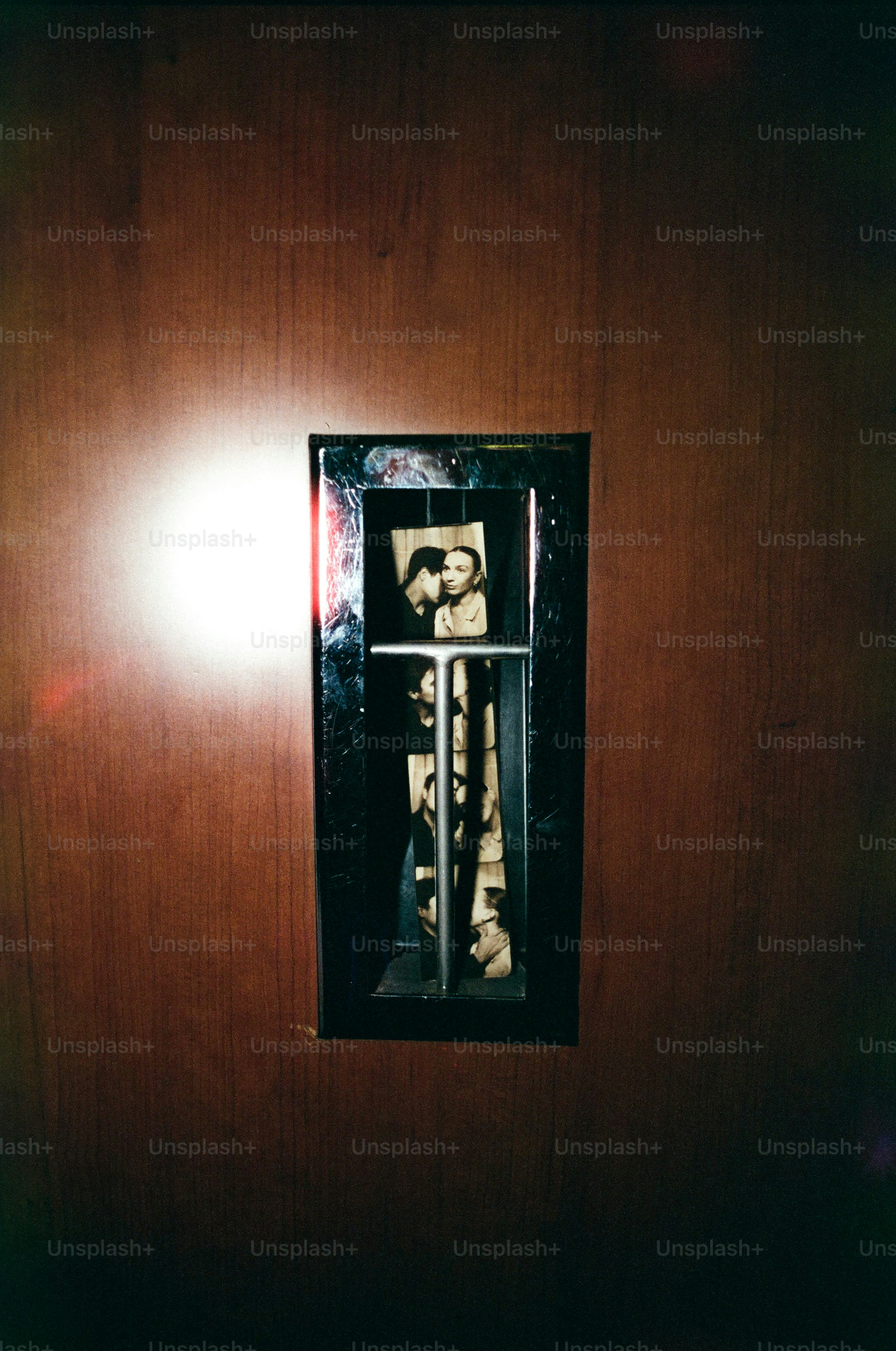 Collage of vintage photos in a wooden frame.