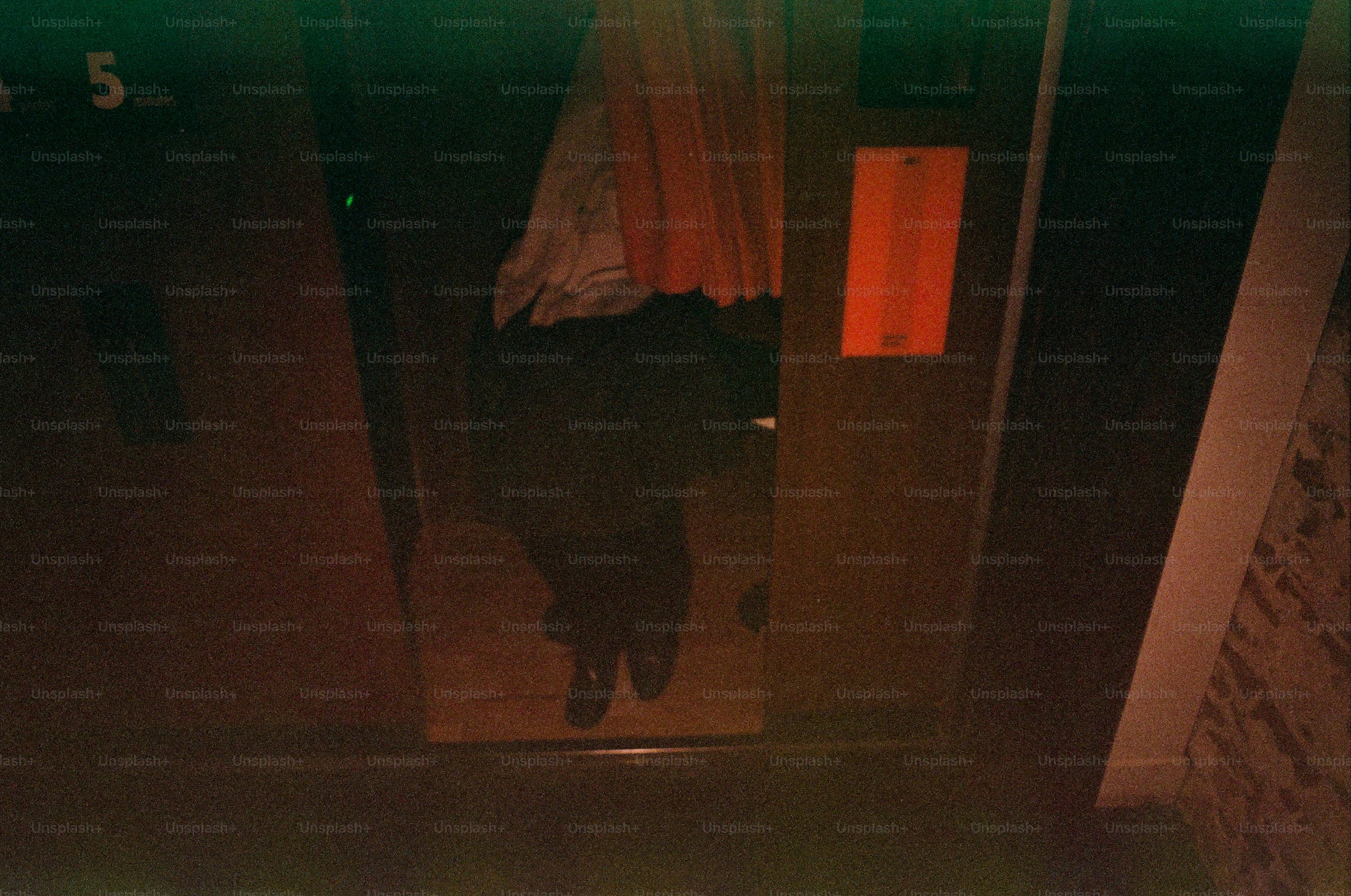 Person reflected in elevator doors