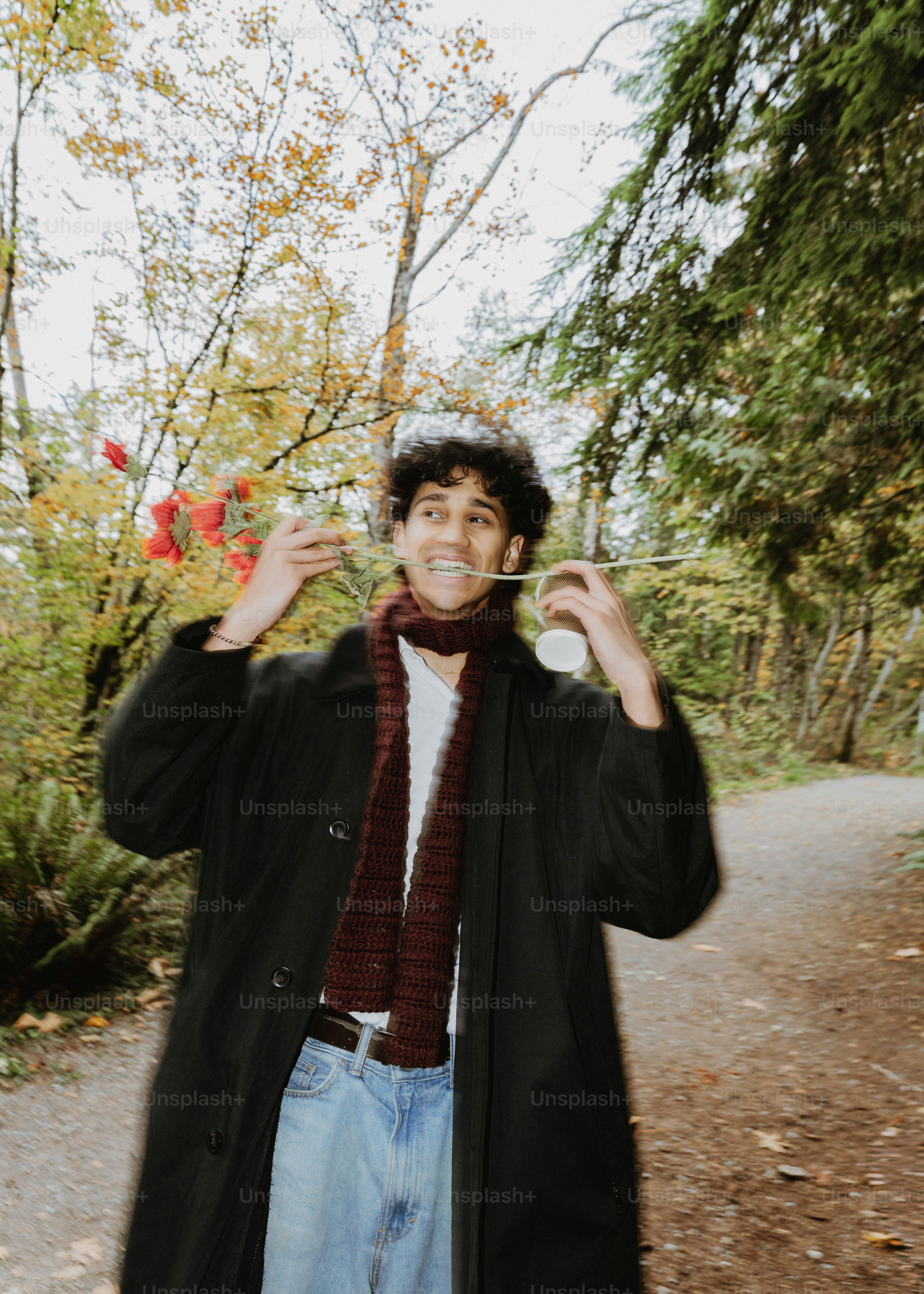 Young man blowing bubbles in a park