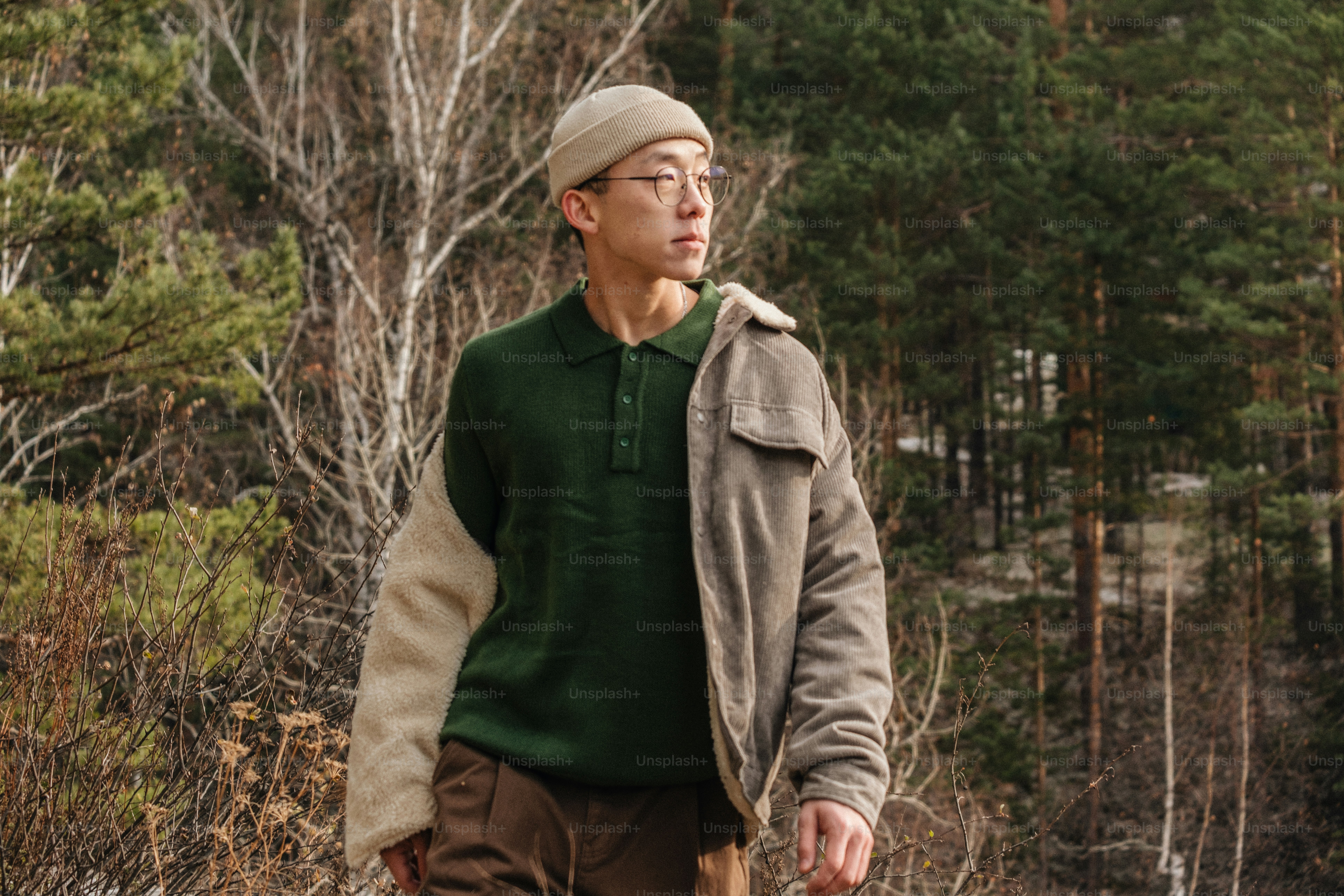 Man walking in a forest with trees