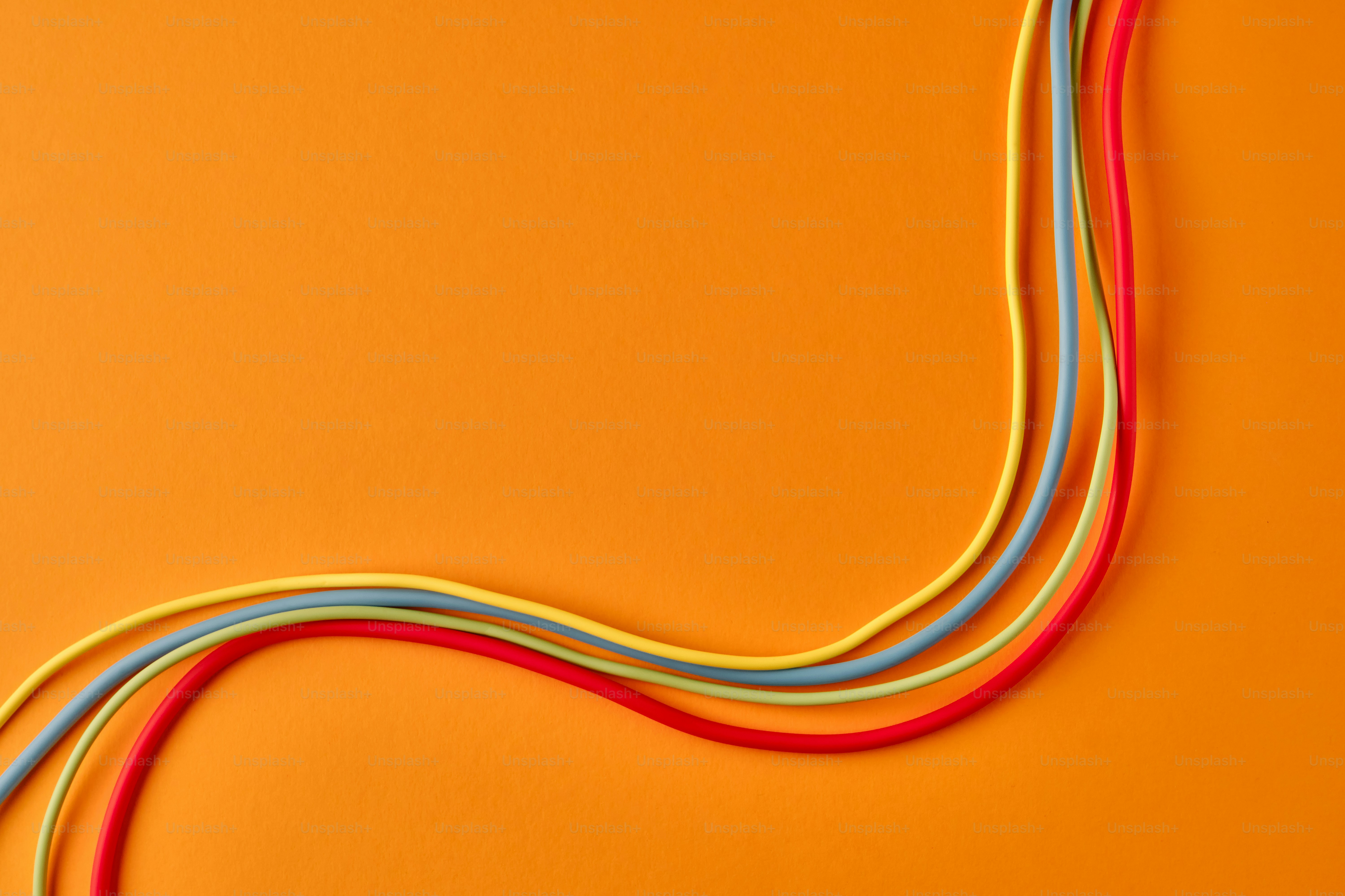 Colorful wires on an orange background