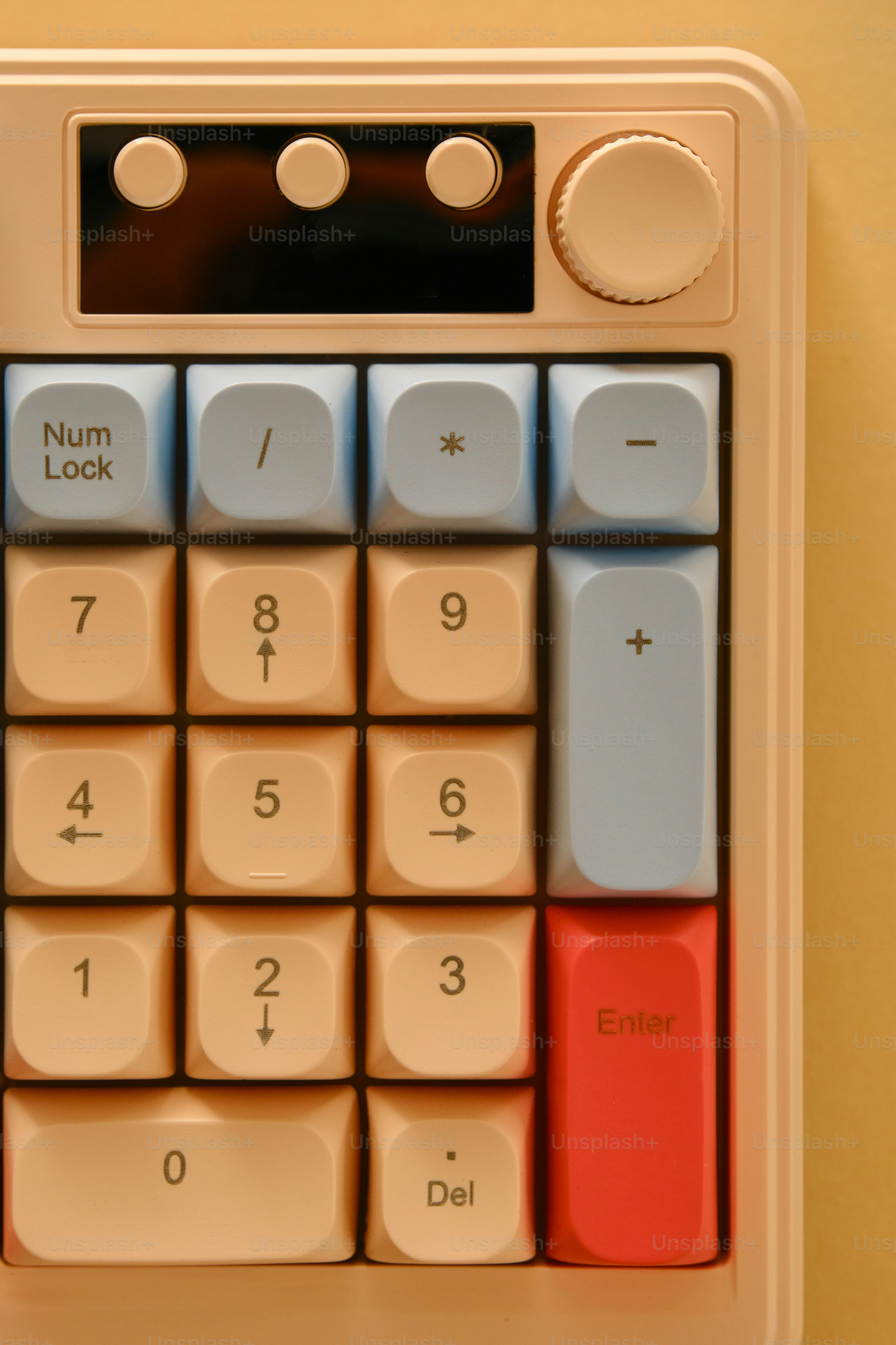 Close-up of a cream and light blue numeric keypad